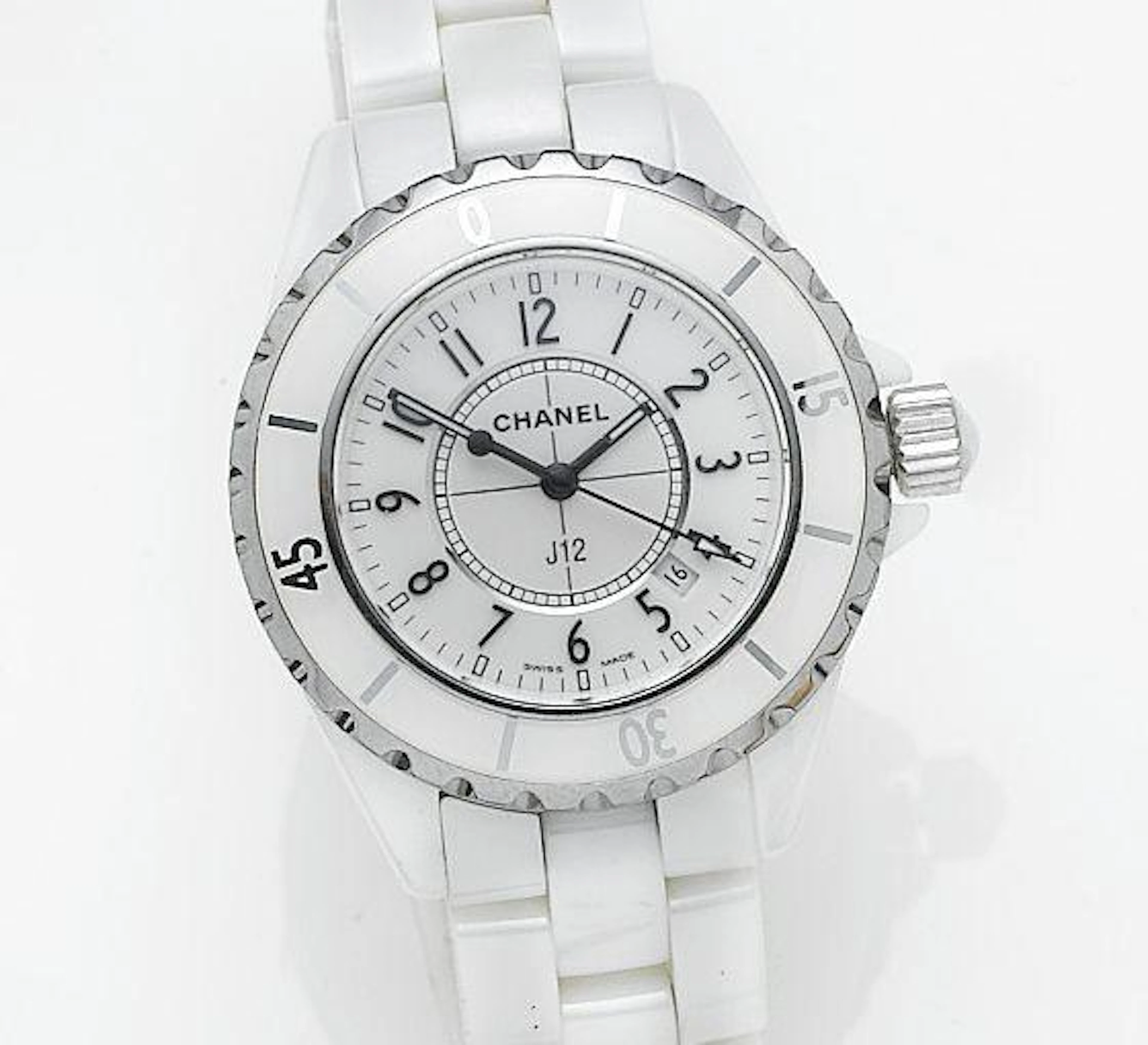Chanel. A lady's mid-sized white ceramic quartz calendar bracelet watch together with spare links, presentation box and papersRef: HO968, Serial No