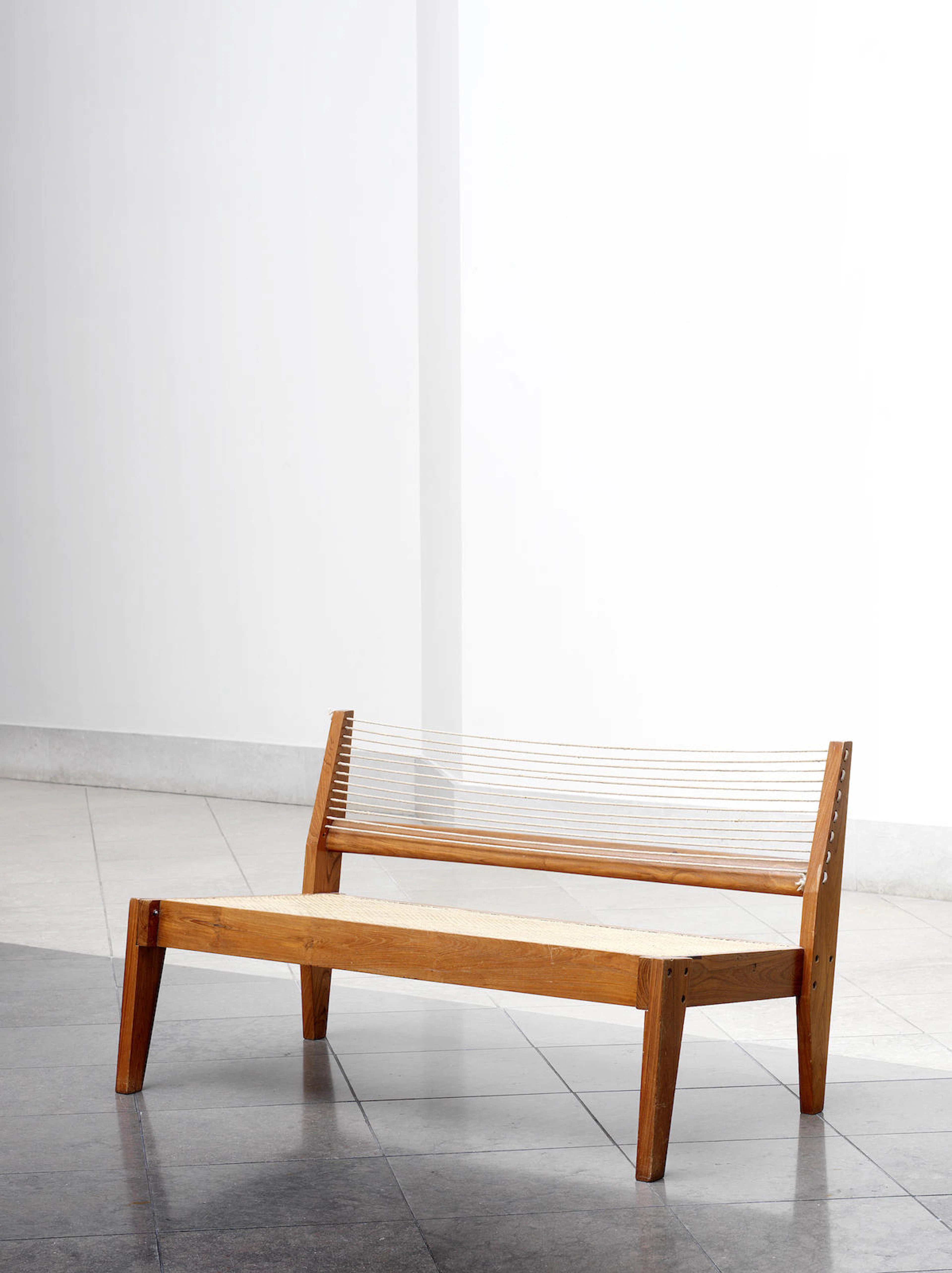 Pierre Jeanneret in collaboration with Maxwell Fry and Jane Drew, a settee, from Jeanneret's residence in Chandigarh, India, designed and executed circa 1950 teak, cane and rope