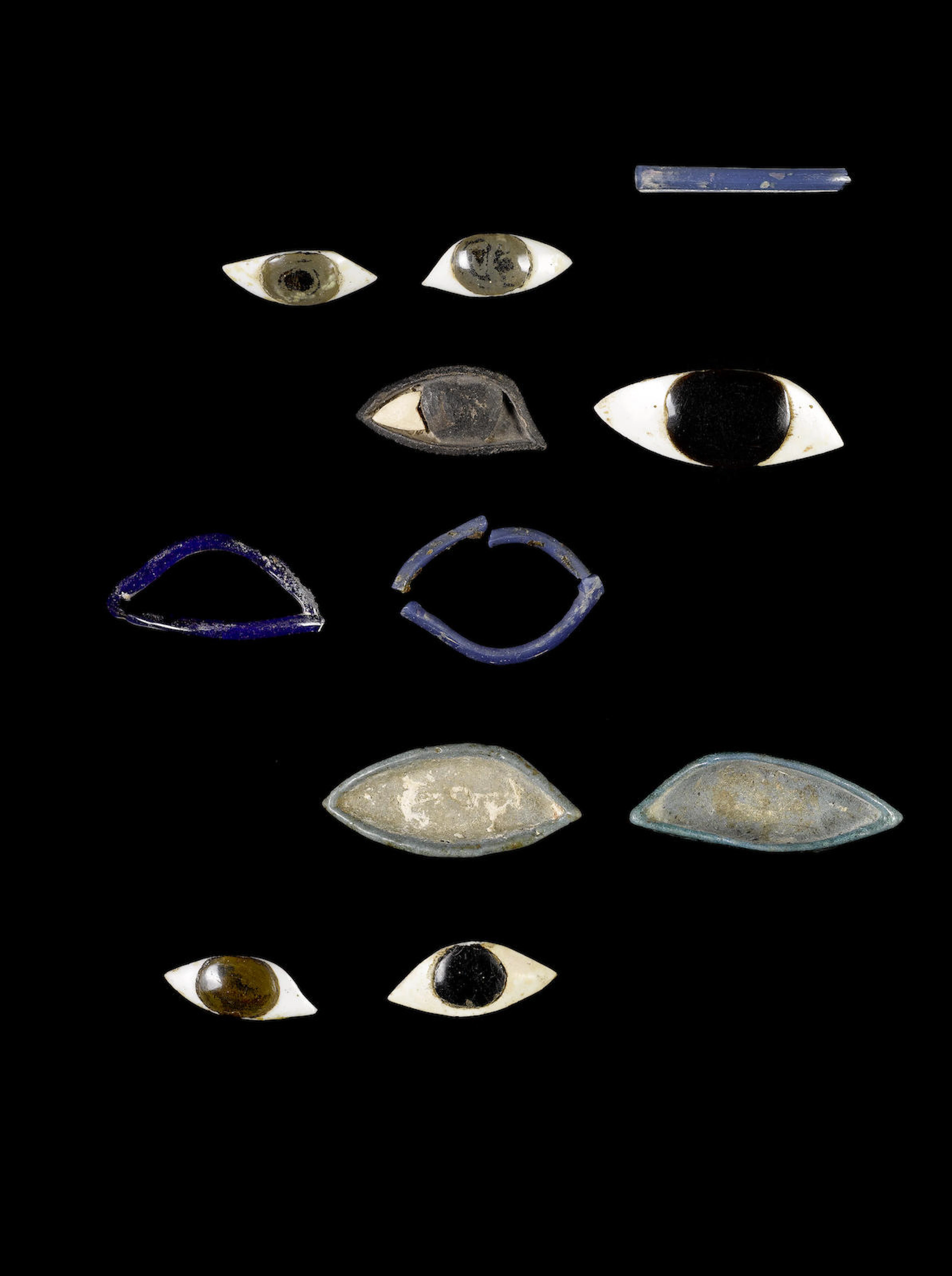 A pair of Egyptian eye inlays and eleven mixed eye fragments 13