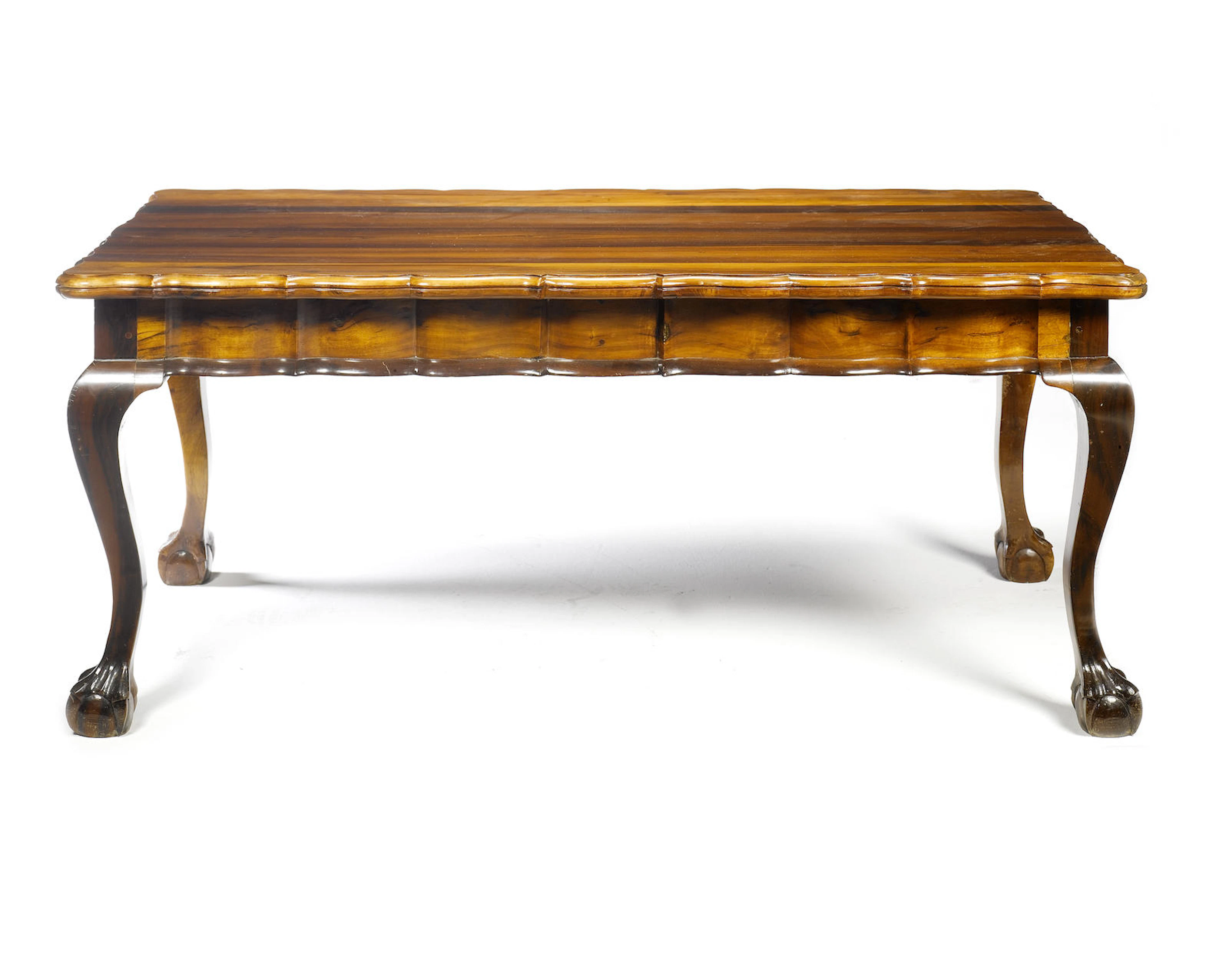 An early 20th century stinkwood dining suite