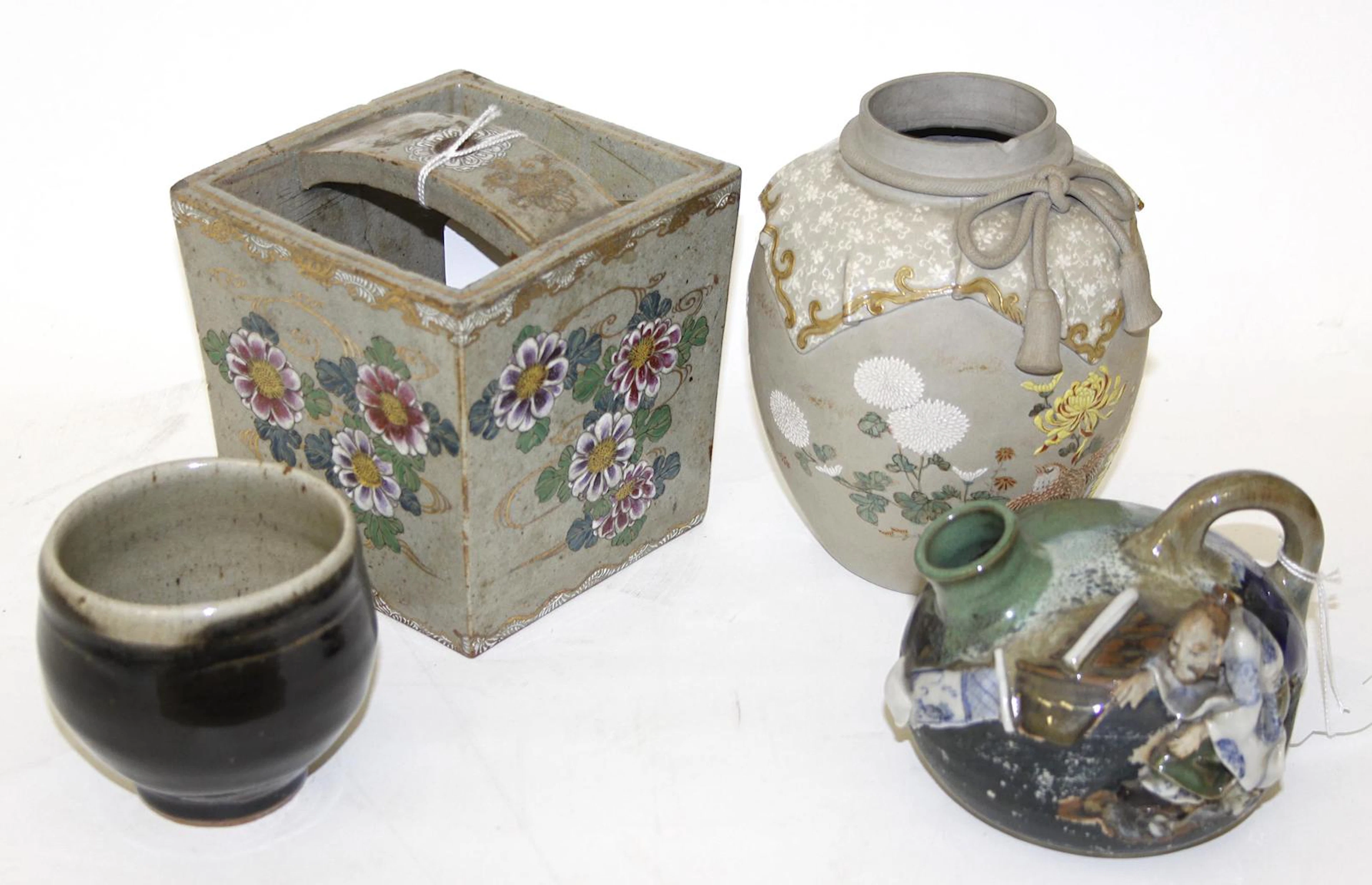 A Japanese square bucket shaped vase,13cm high, a Somaware oil pot with moulded figure, 10cm high, a small pottery bowl and a Japanese unglazed ovoid vase (no cover).(4)
