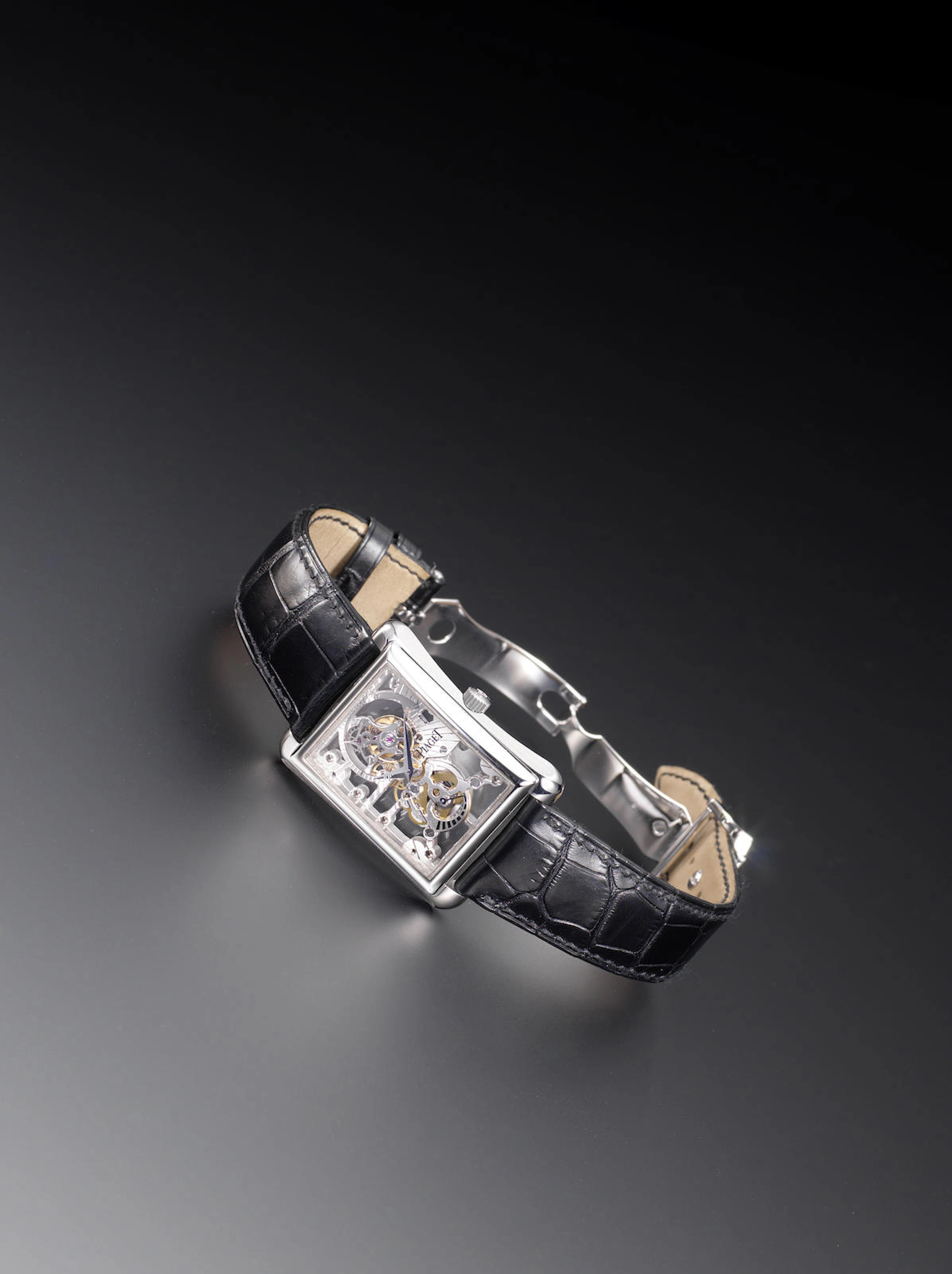 Piaget. An 18ct white gold manual wind skeleton tourbillon wristwatch with retrograde power reserve Black Tie Emperador, Reference P10207, Case Number 940619, Recent
