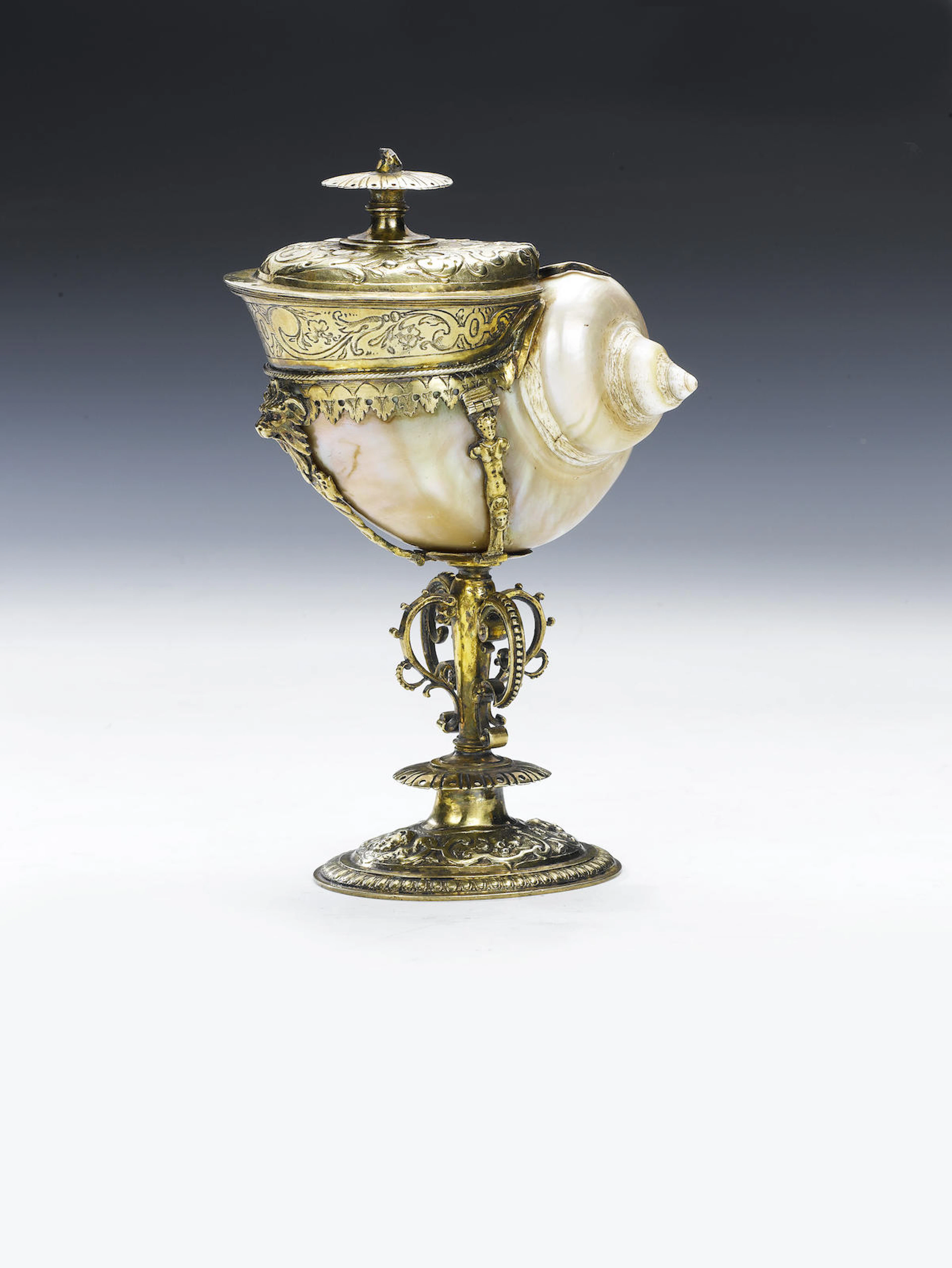 A late 16th/early 17th century Dutch silver-gilt mounted "turban" shell nautilus cup and associated cover, Utrecht, date letter "K", possibly 1605, maker's mark three lozenges in a shield, for Eersten