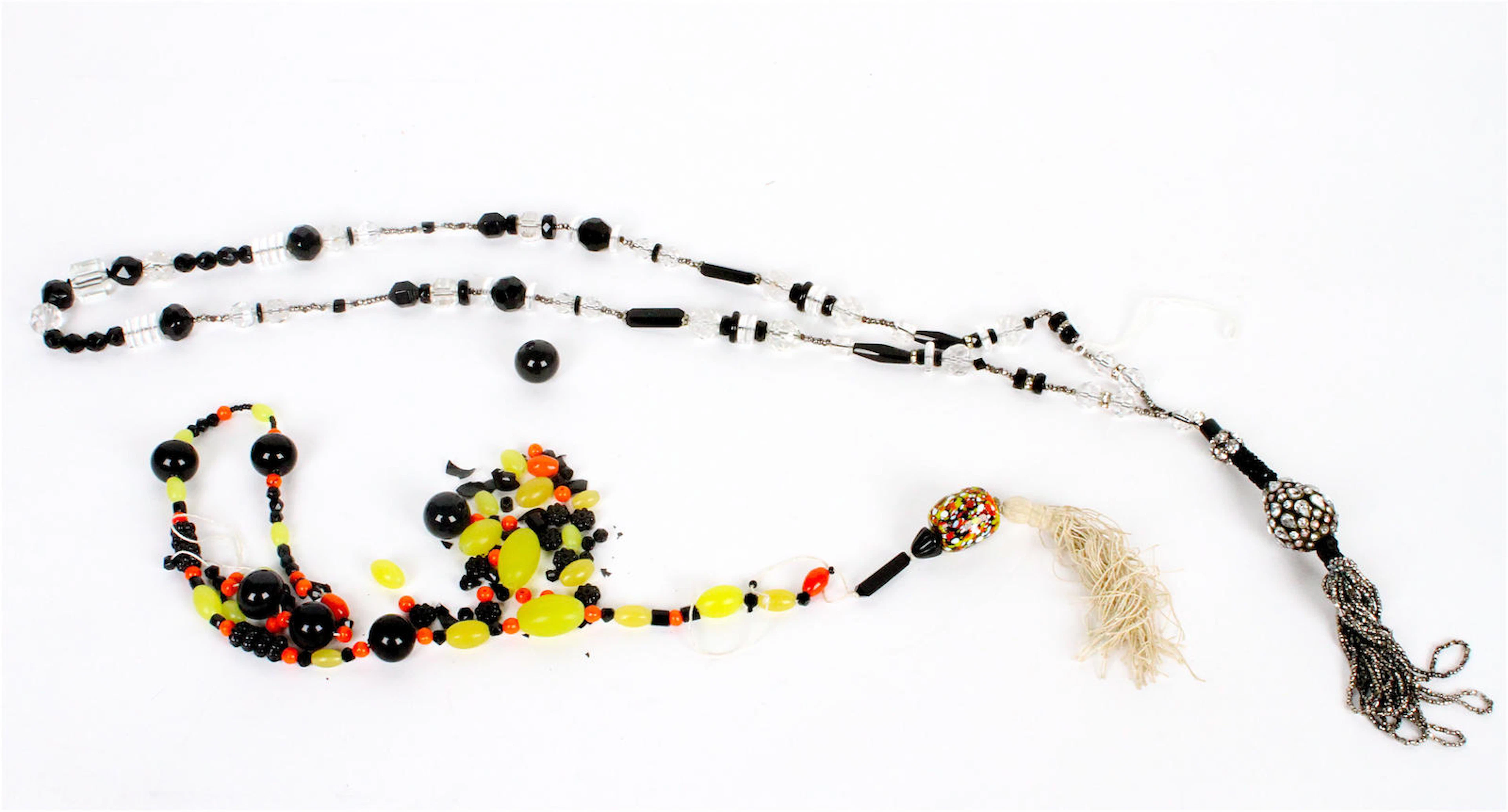 An Art Deco black and colourless paste sautoir (2)