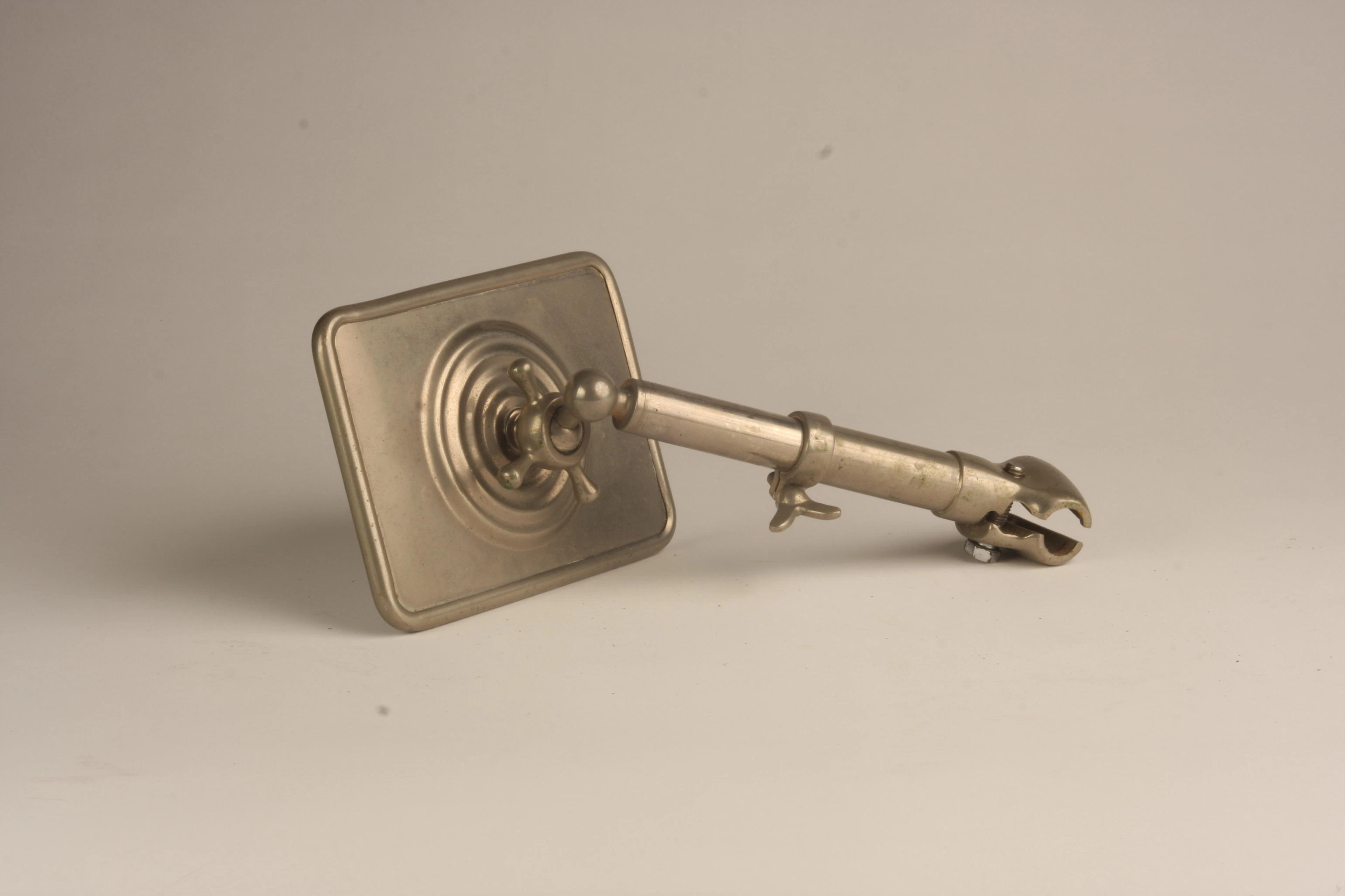 A large nickel plated brass mirror,