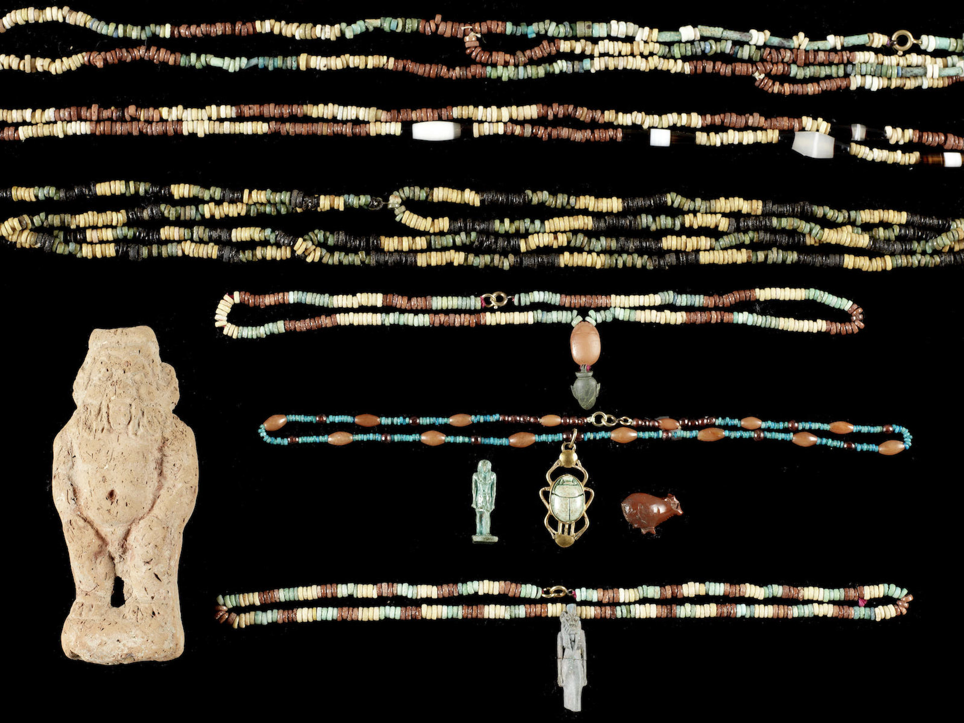 A group of Egyptian antiquities and a Romano-Egyptian hollow terracotta figure of Bes, 9