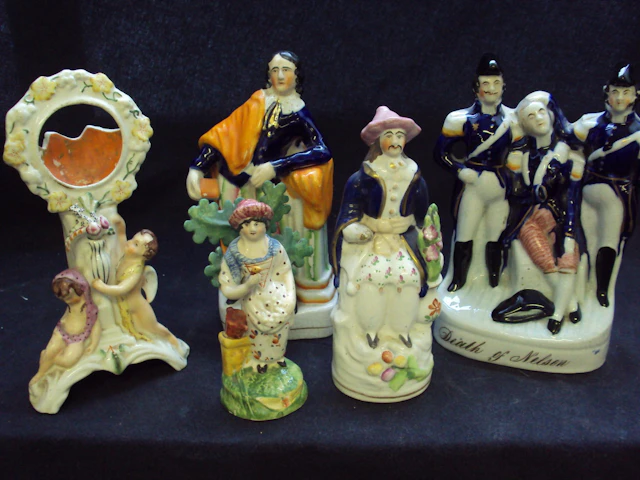 A small group of Staffordshire figures