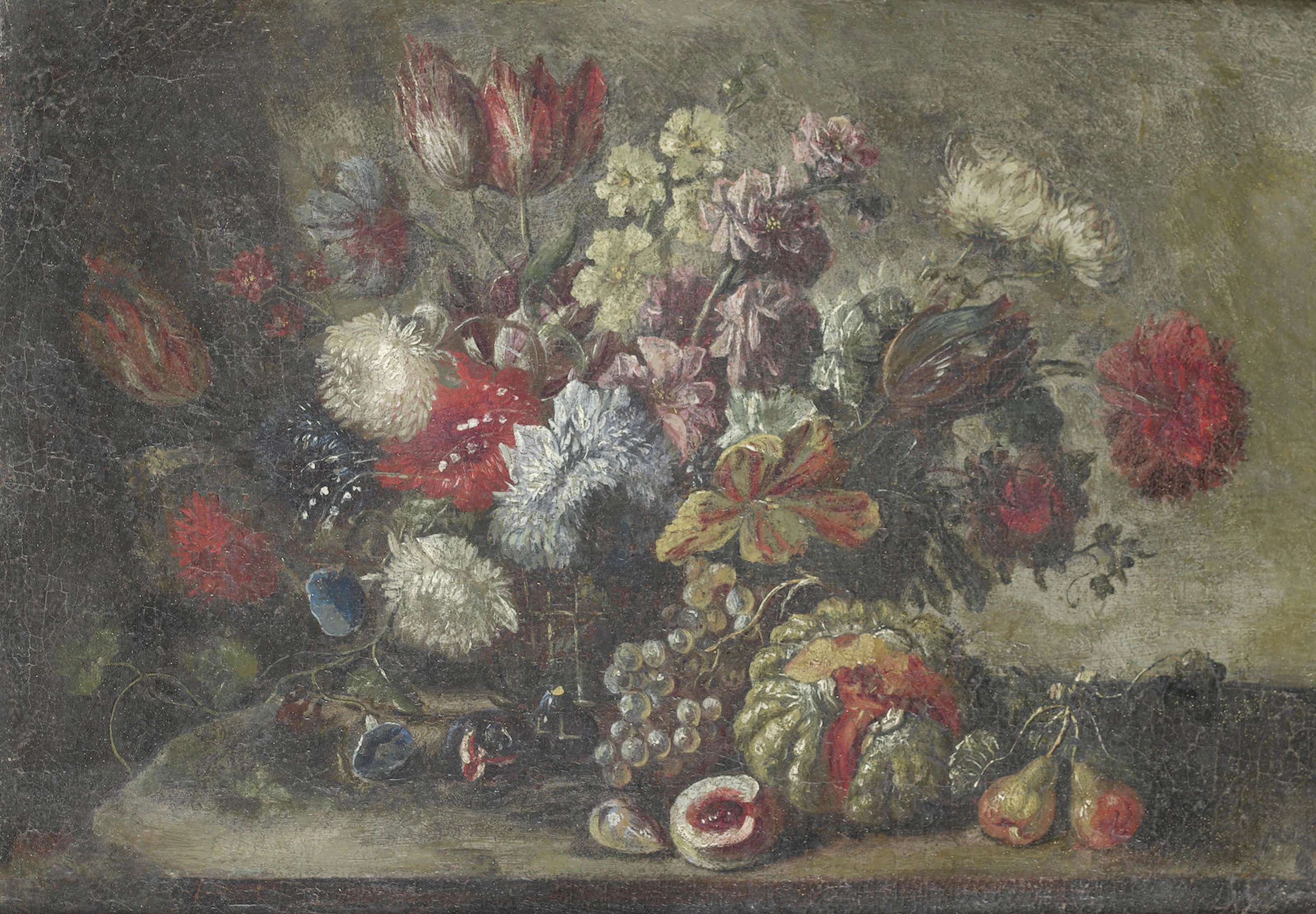 Roses, carnations, tulips and other flowers in a wicker basket on a table top, with pears, grapes and other fruit