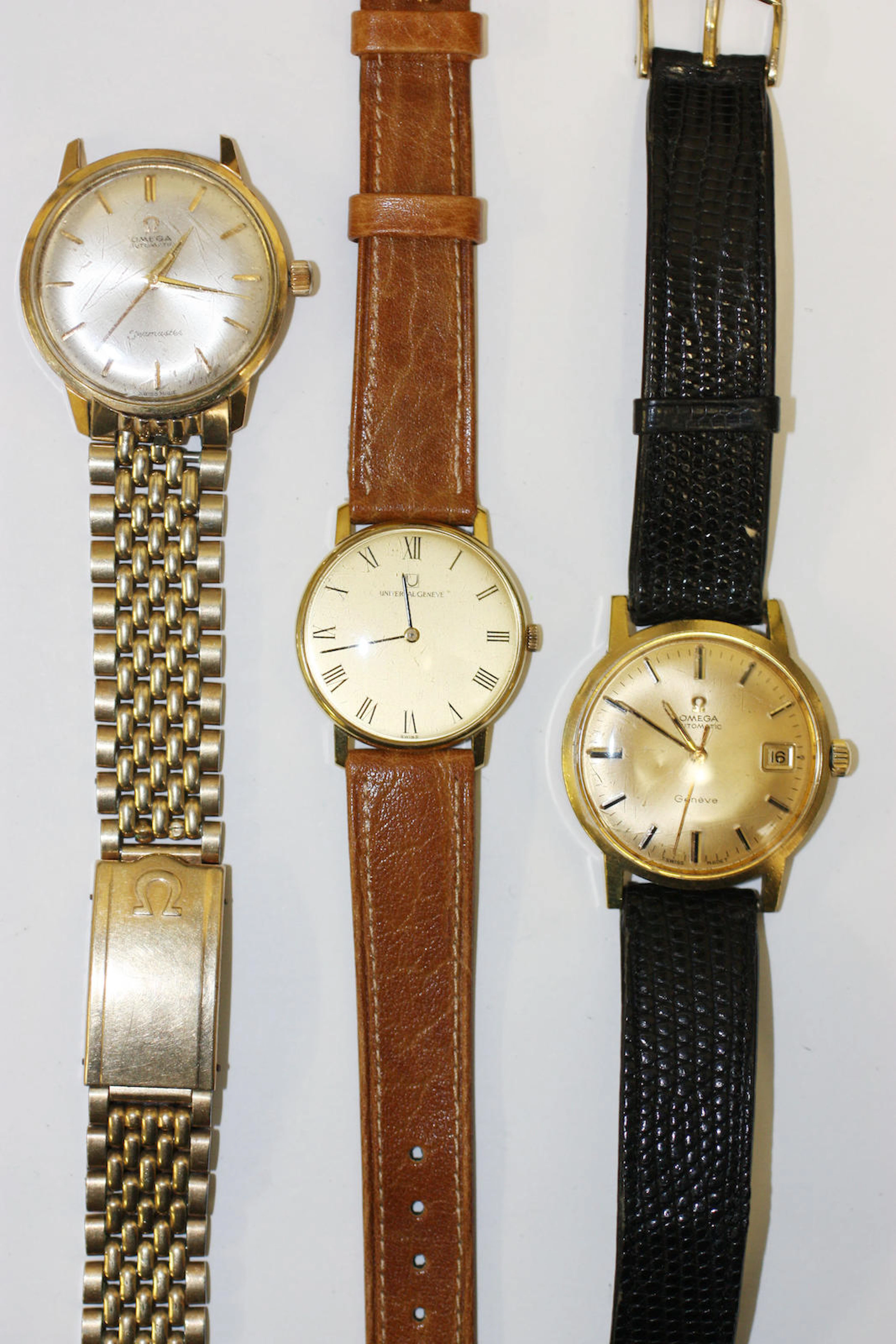 Two Omega gentlemans wristwatches and a mid-sized Universal Geneve wristwatch,