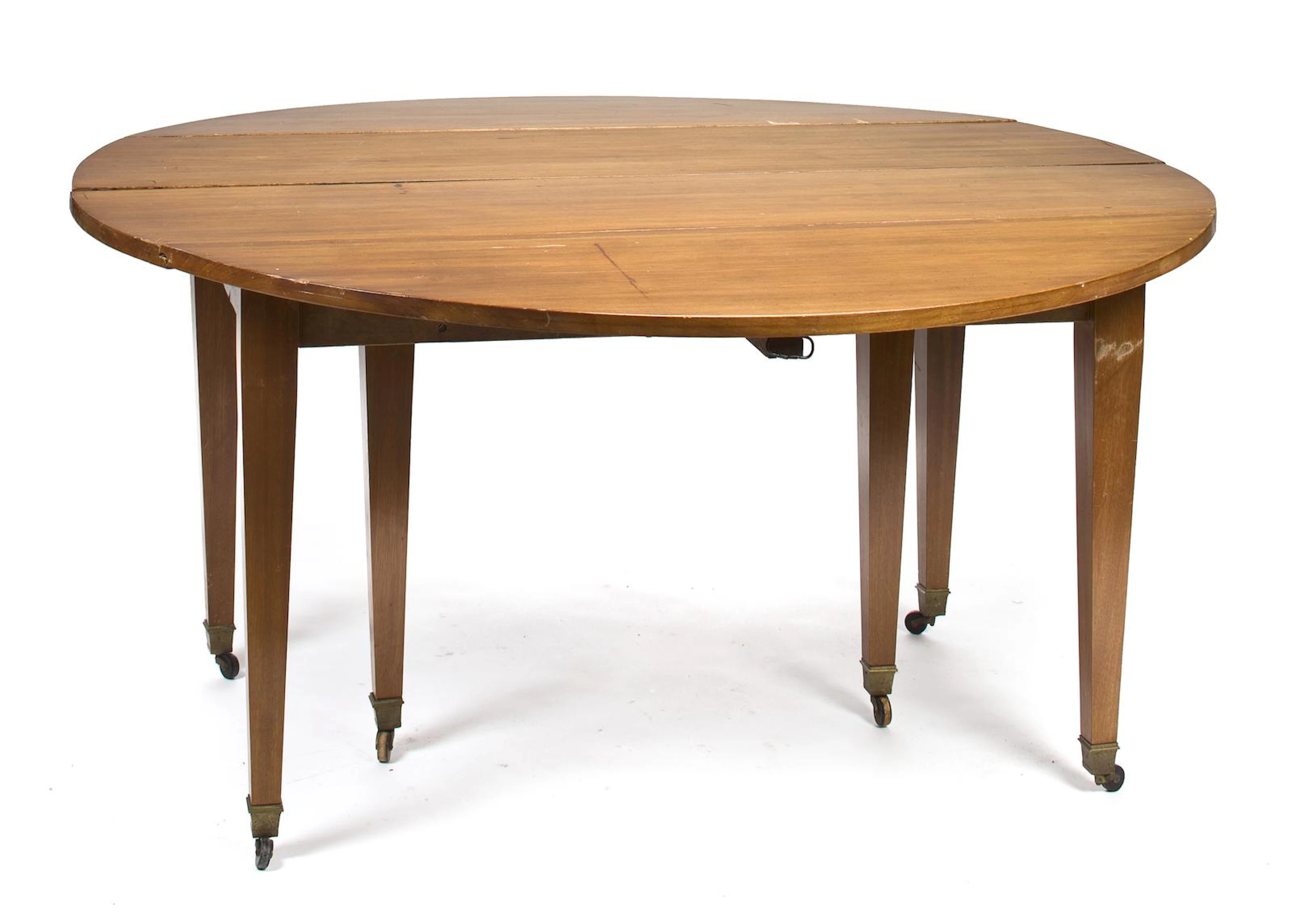 A French Restauration walnut drop leaf extension dining table first quarter 19th century