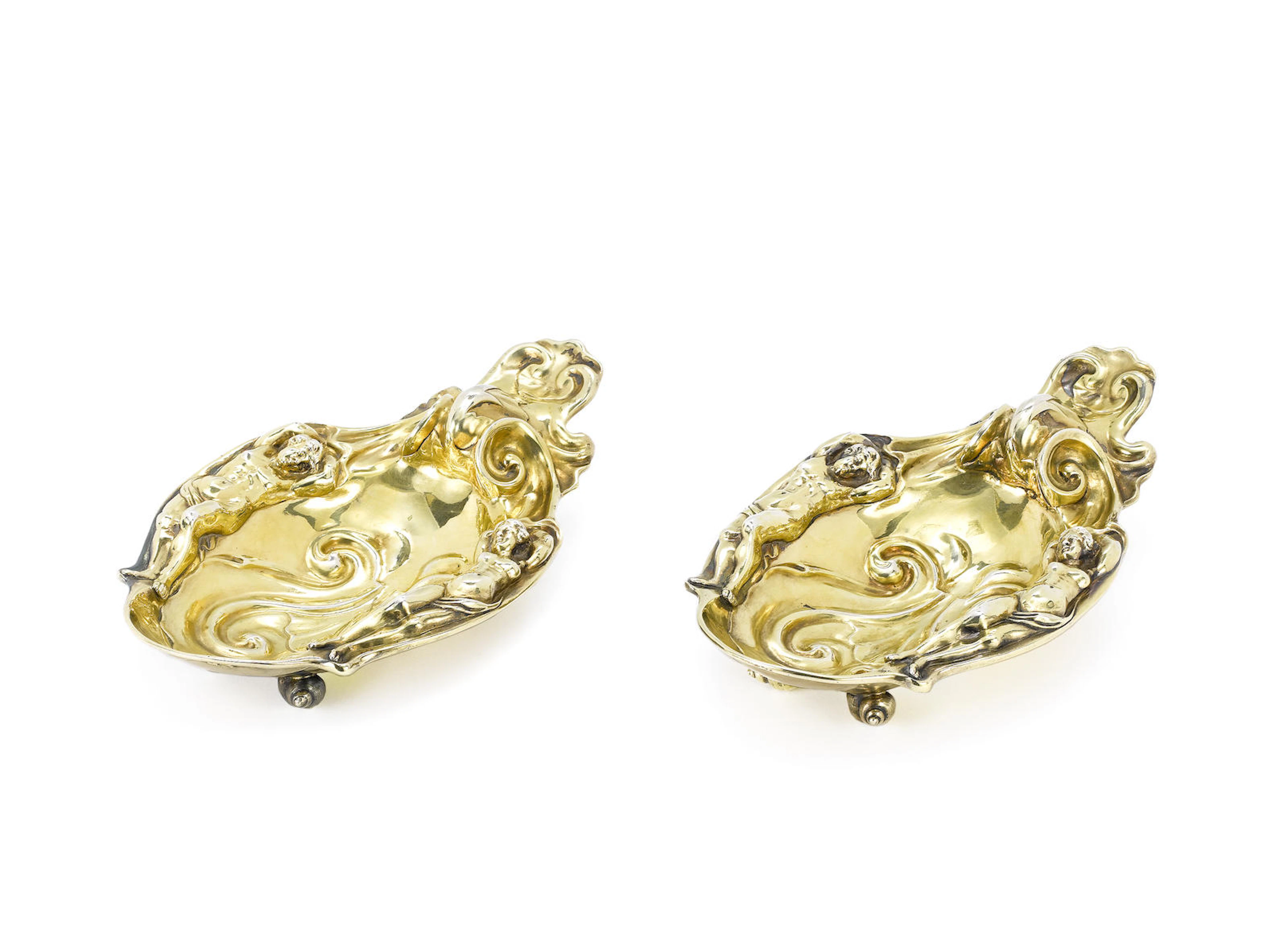 Two 18th/19th century unmarked silver-gilt auricular dishes after Christian Van Vianen, unmarked, (2)