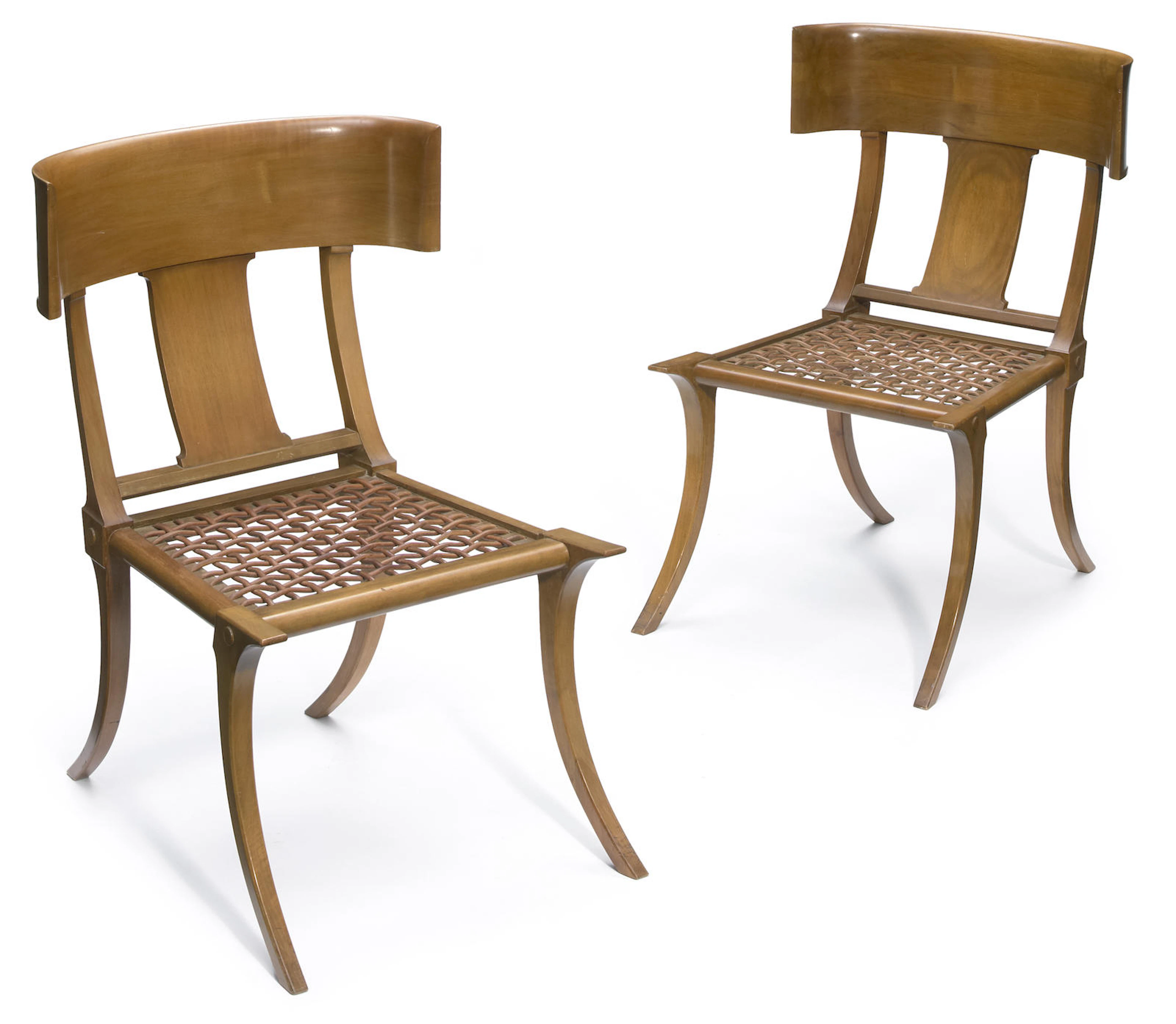 A pair of T.H. Robsjohn-Gibbings for Saridis of Athens walnut and leather Klismos chairs designed 1961