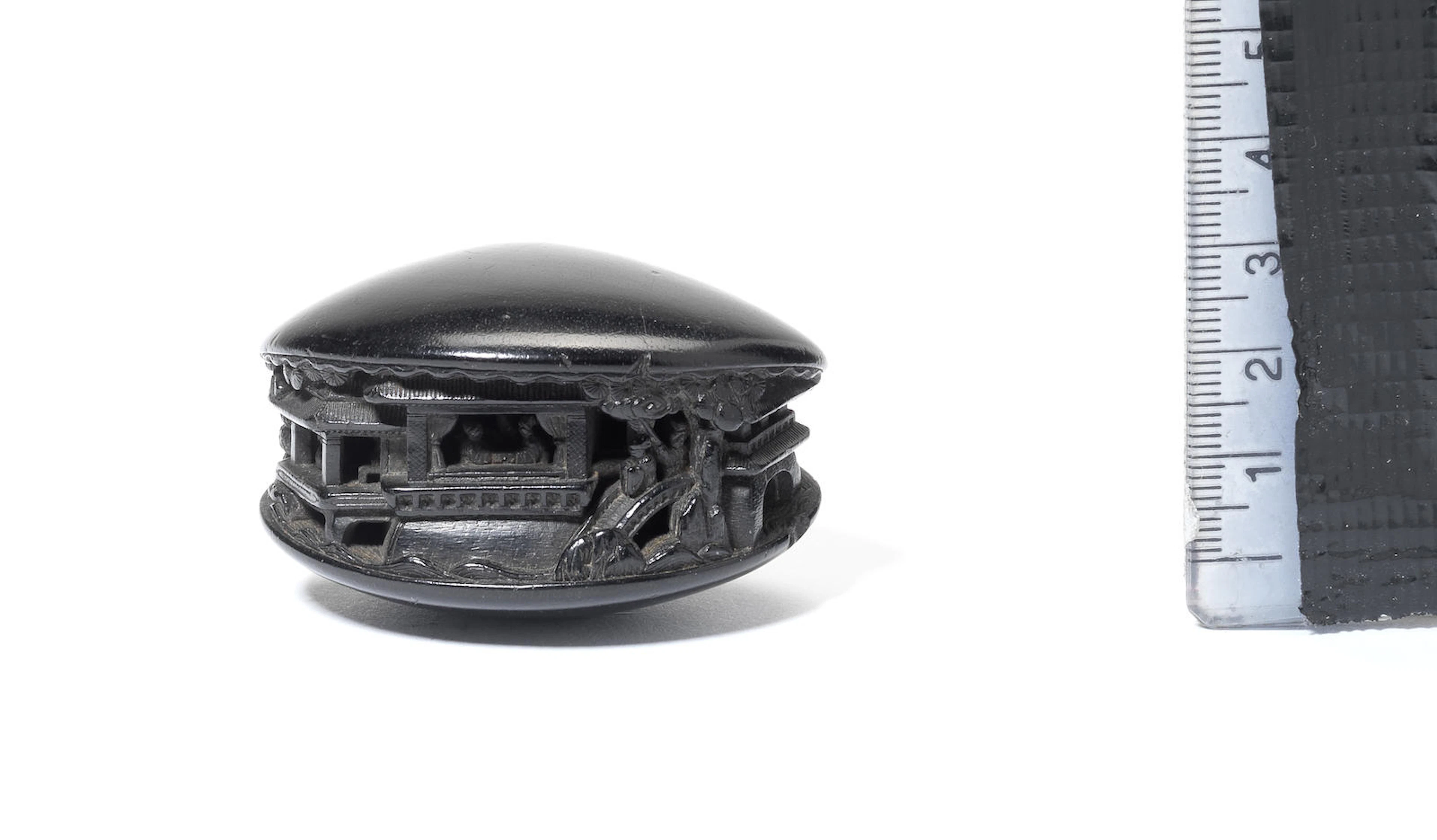 An ebony netsuke of the clam's dream Early 19th century