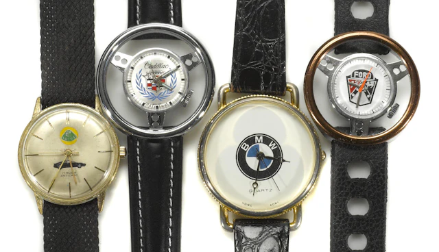 A collection of 4 mens automobile watches of various marques,