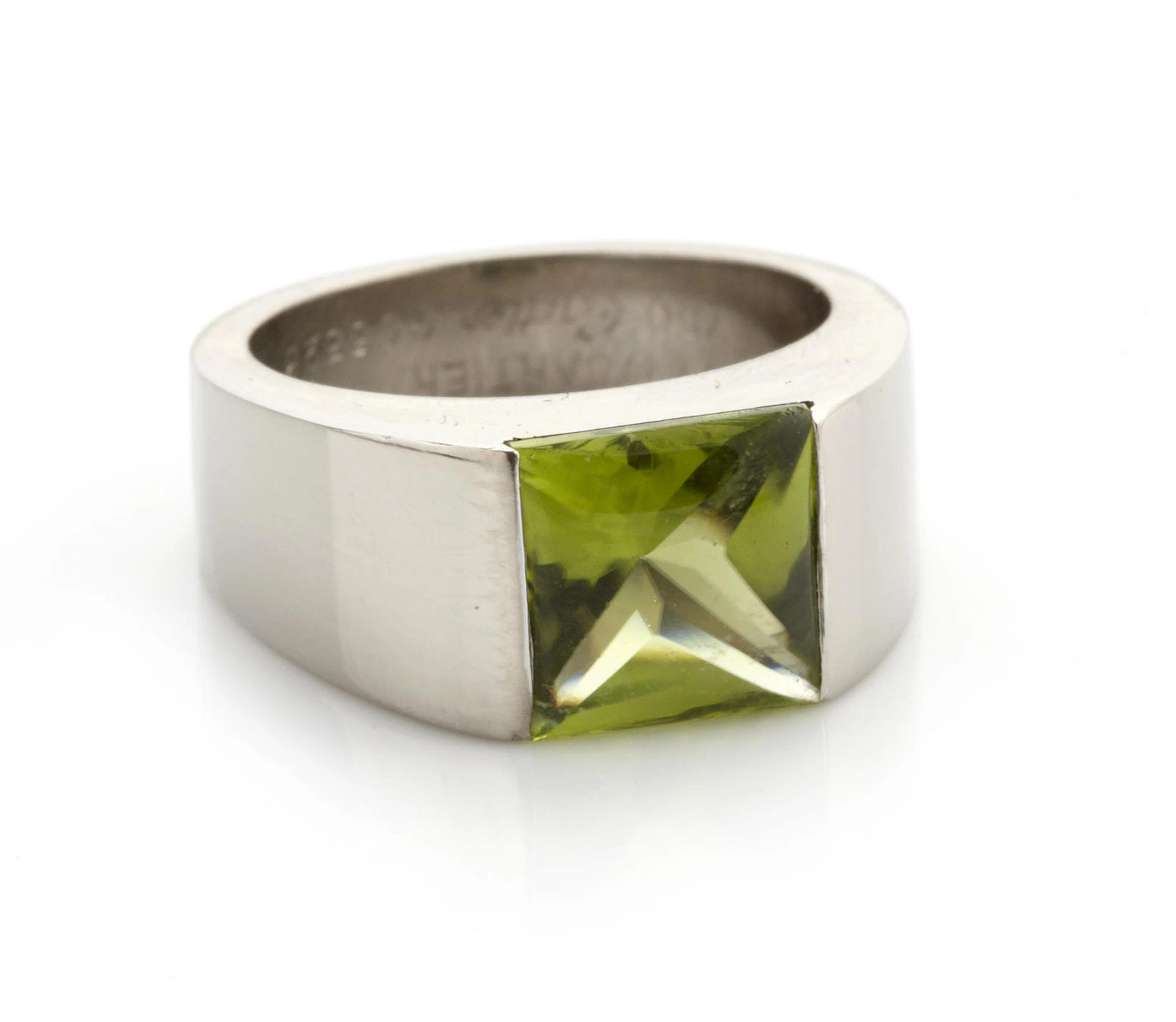A peridot and 18 karat white gold ring, Cartier