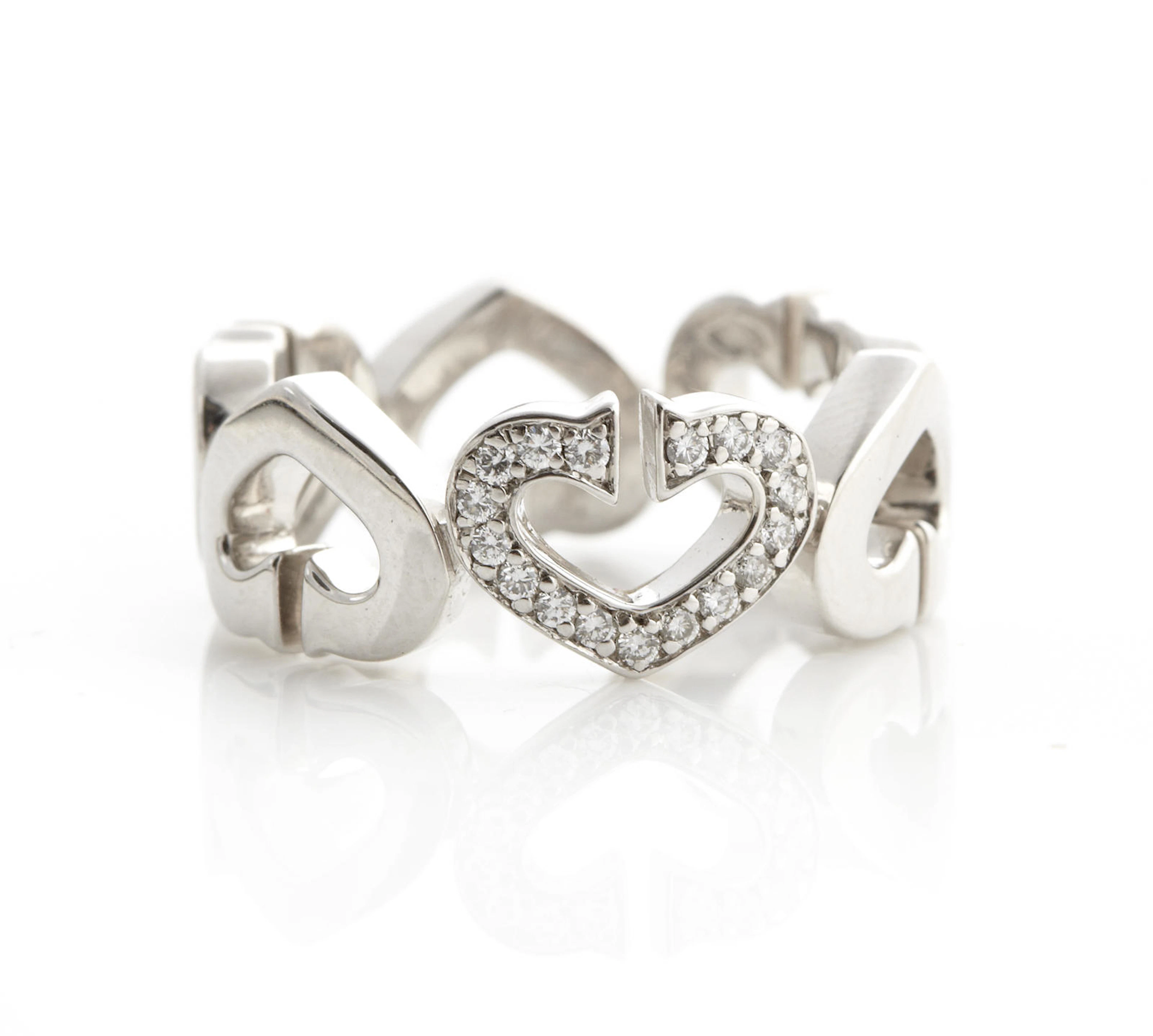 A diamond and 18 karat white gold "C" heart ring,