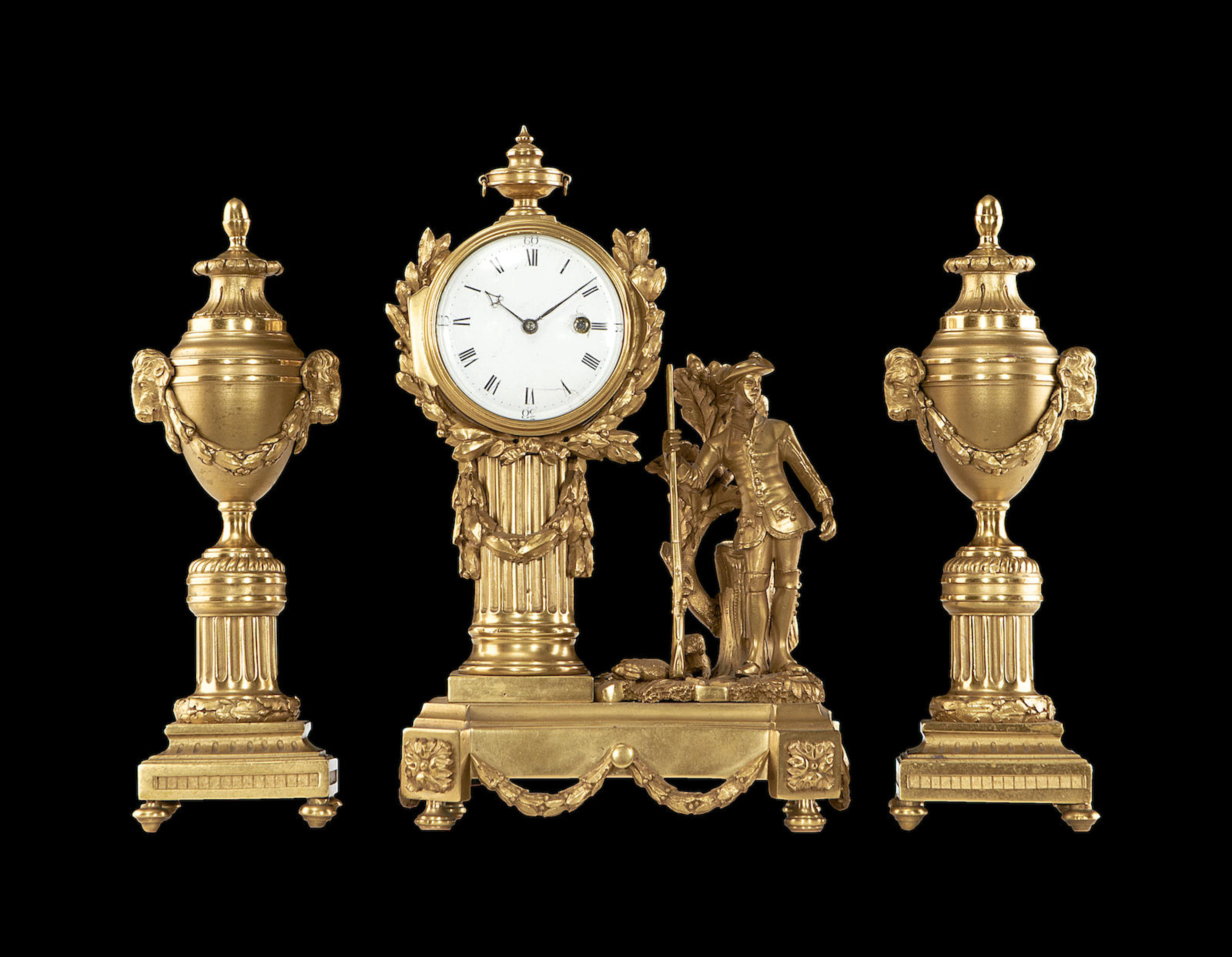 A late 18th century century gilt bronze figural timepiece garniture