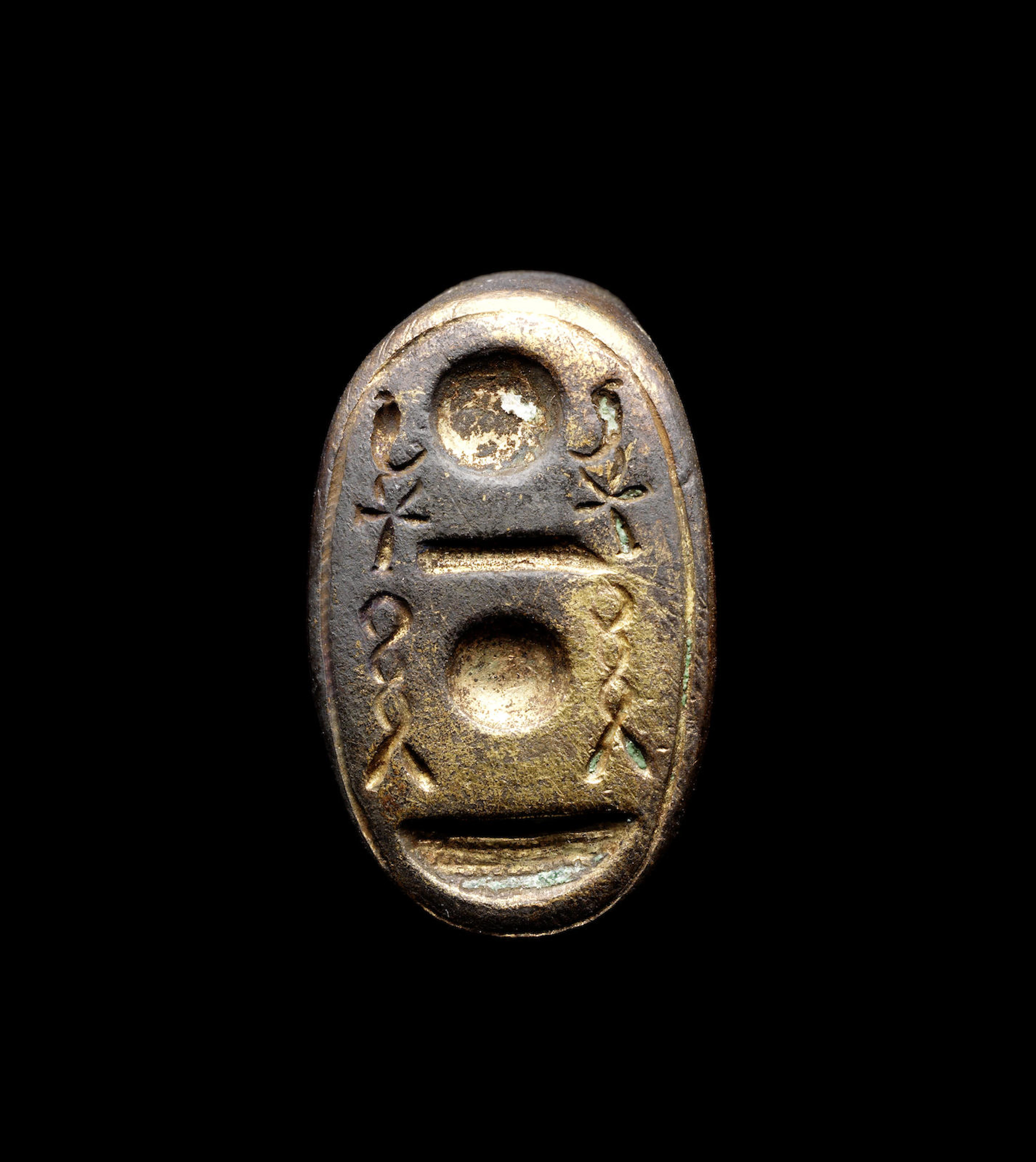 An Egyptian gilt bronze stirrup ring