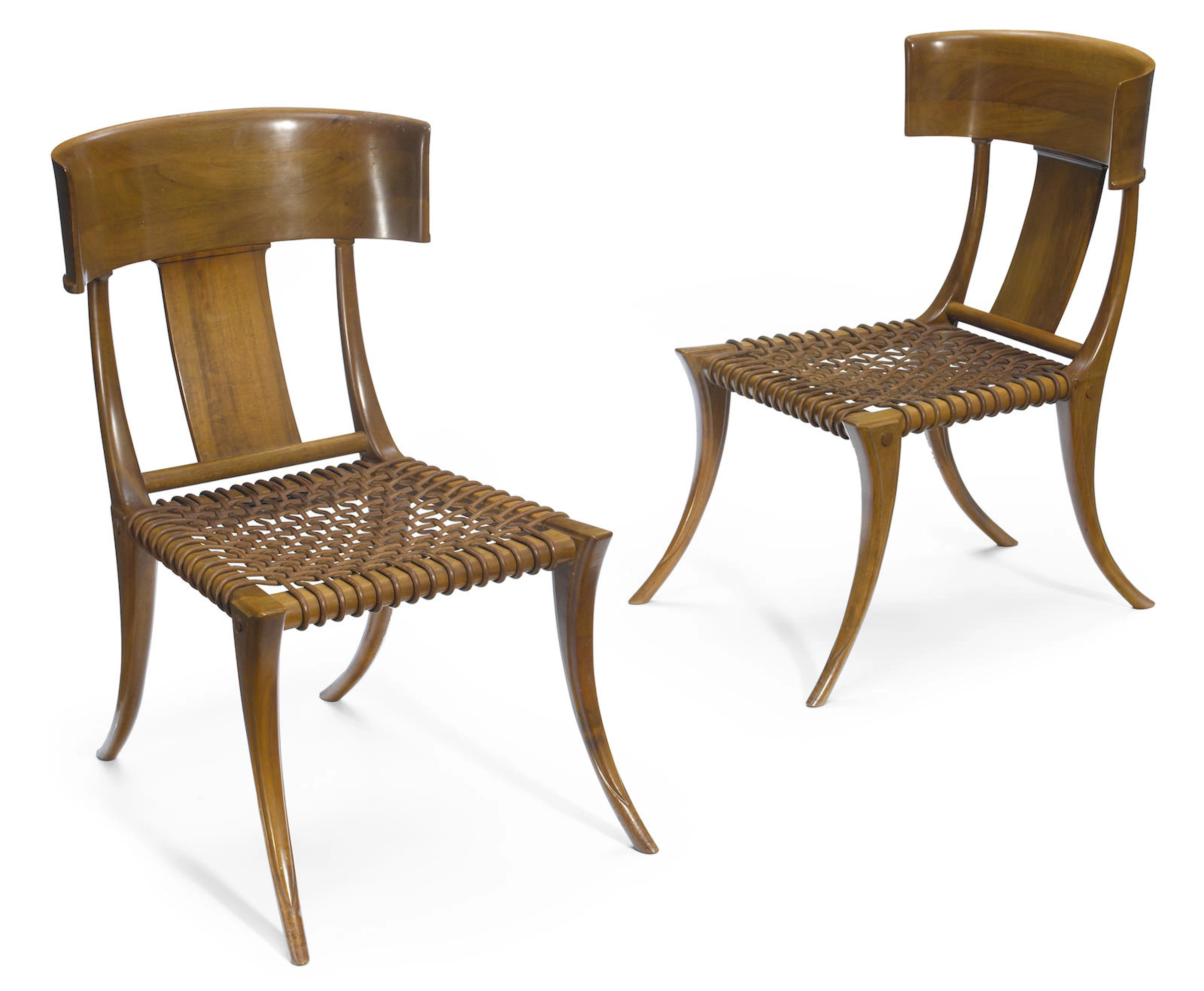A pair of T.H. Robsjohn-Gibbings for Saridis of Athens walnut and leather Klismos chairs designed 1961