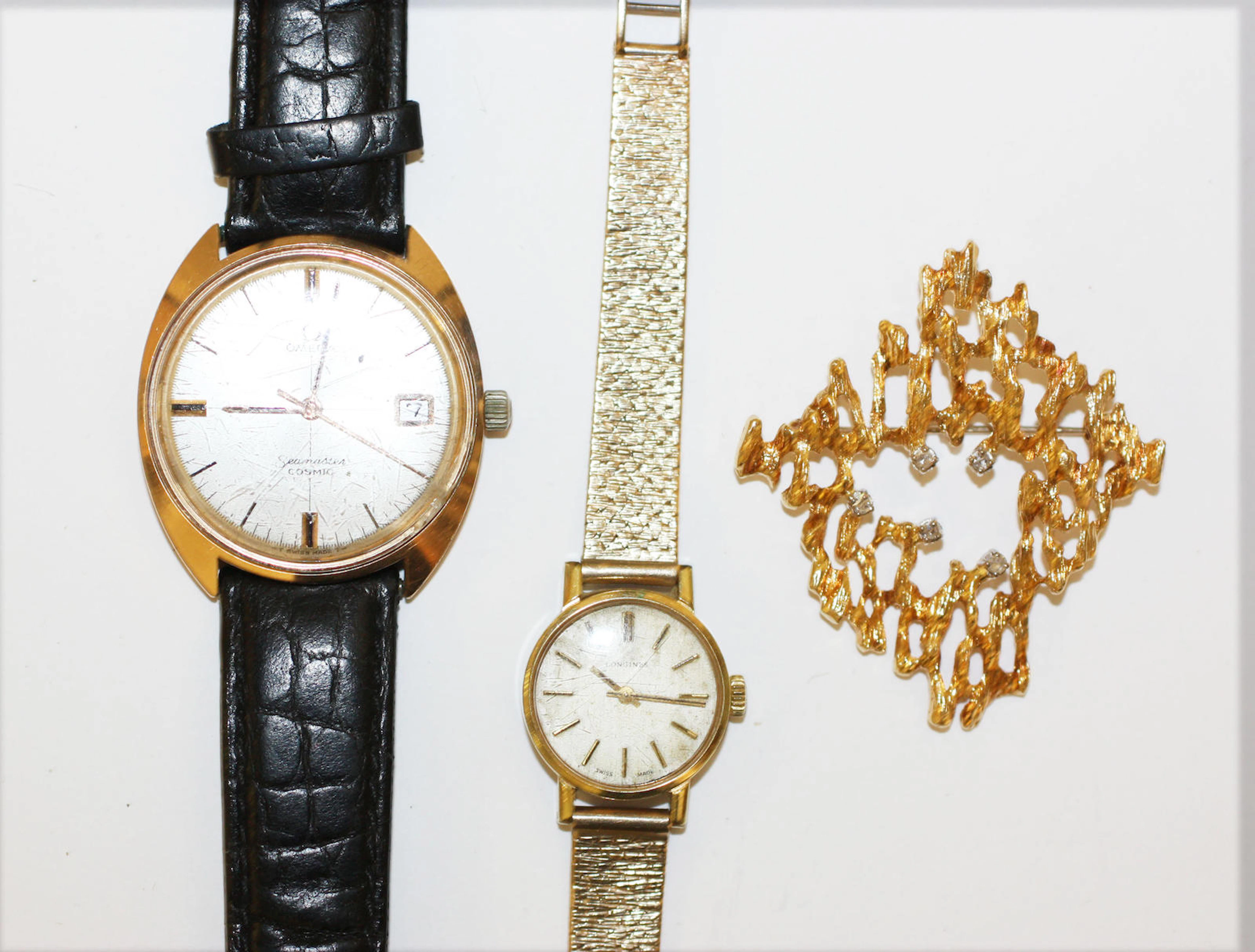 Two watches and a diamond set brooch,