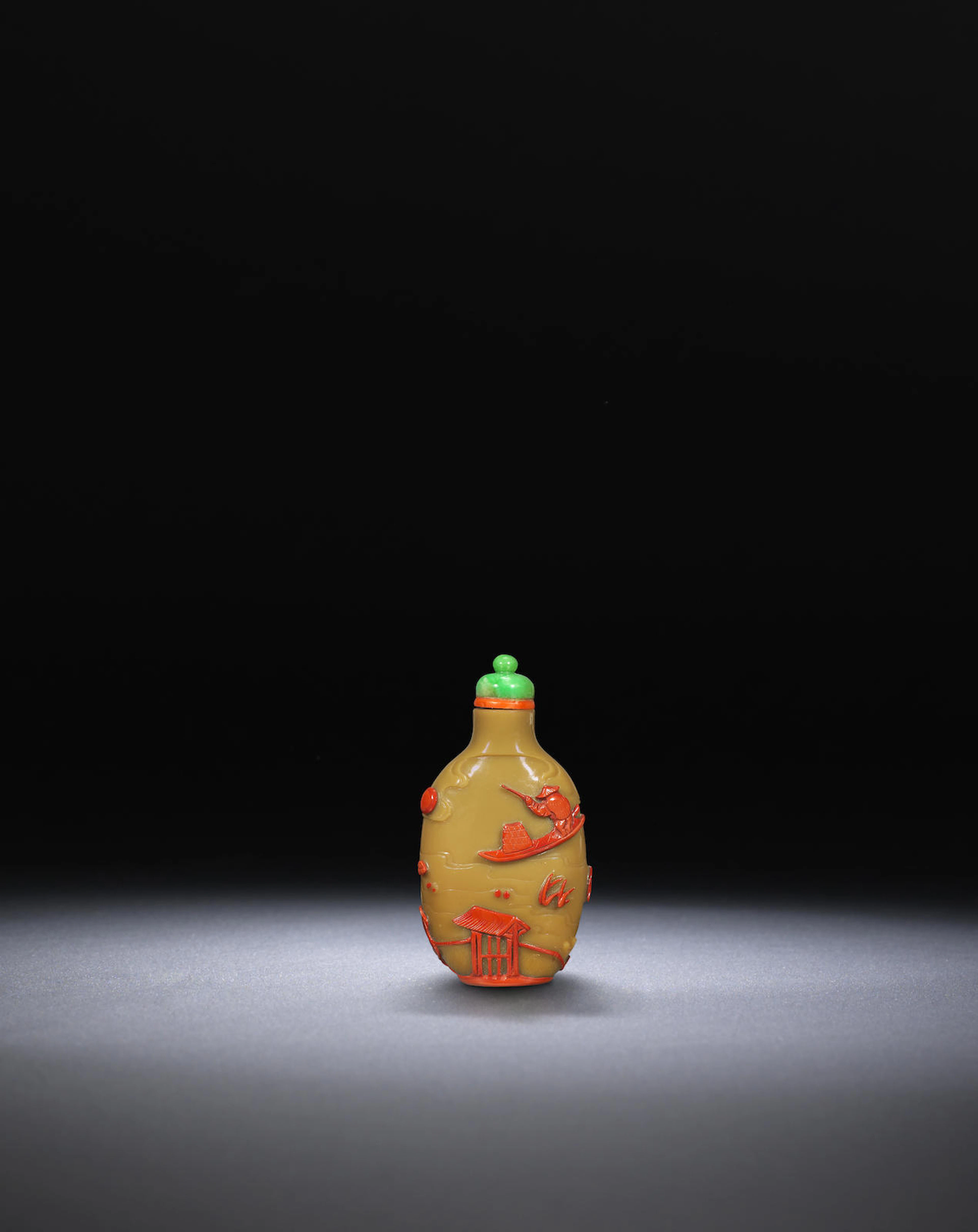 A caramel-beige and cinnabar-red overlay glass 'pavilion and fisherman' snuff bottle Attributed to Yangzhou, circa 1860-1890