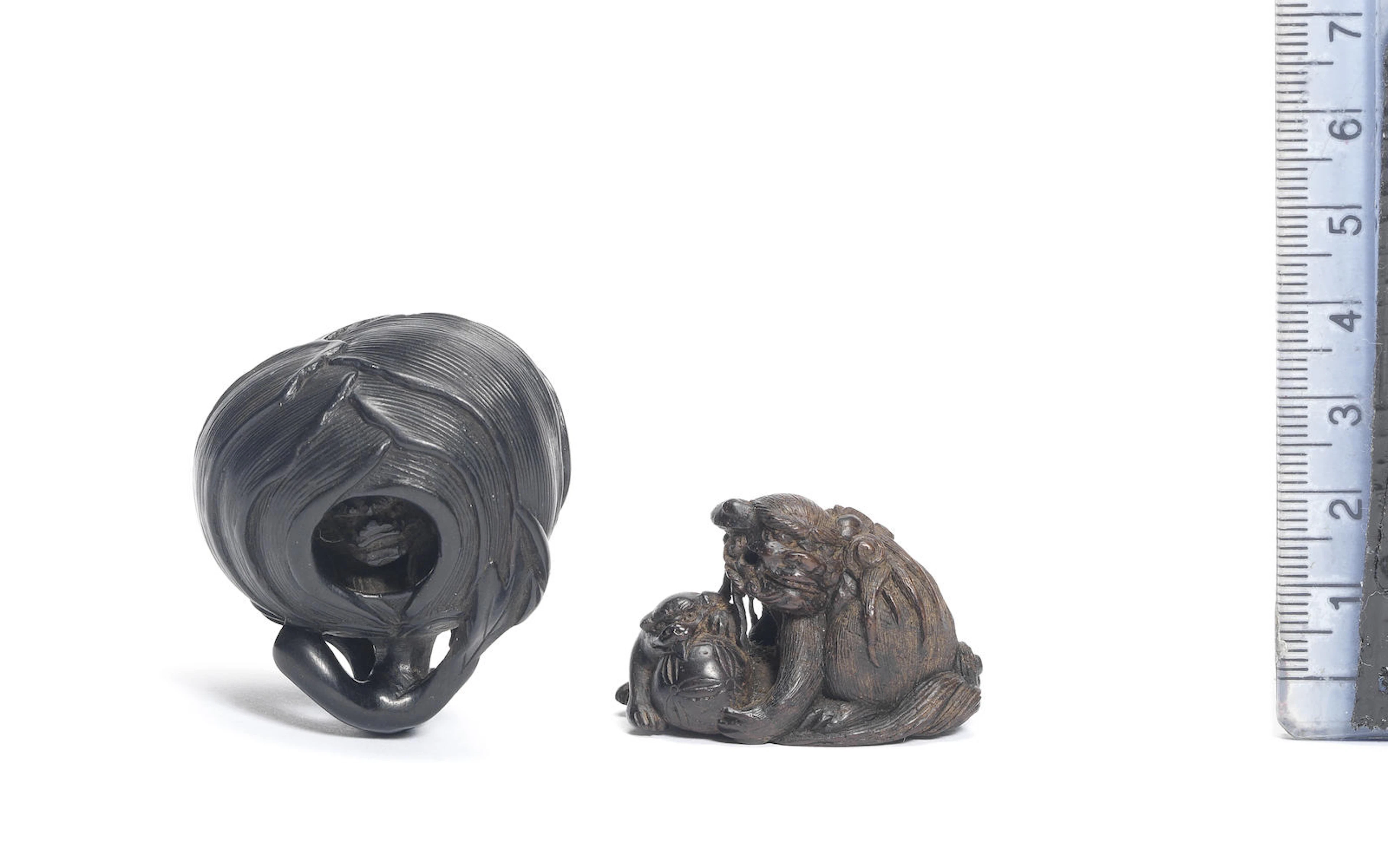 Two ebony netsuke of shishi 19th century
