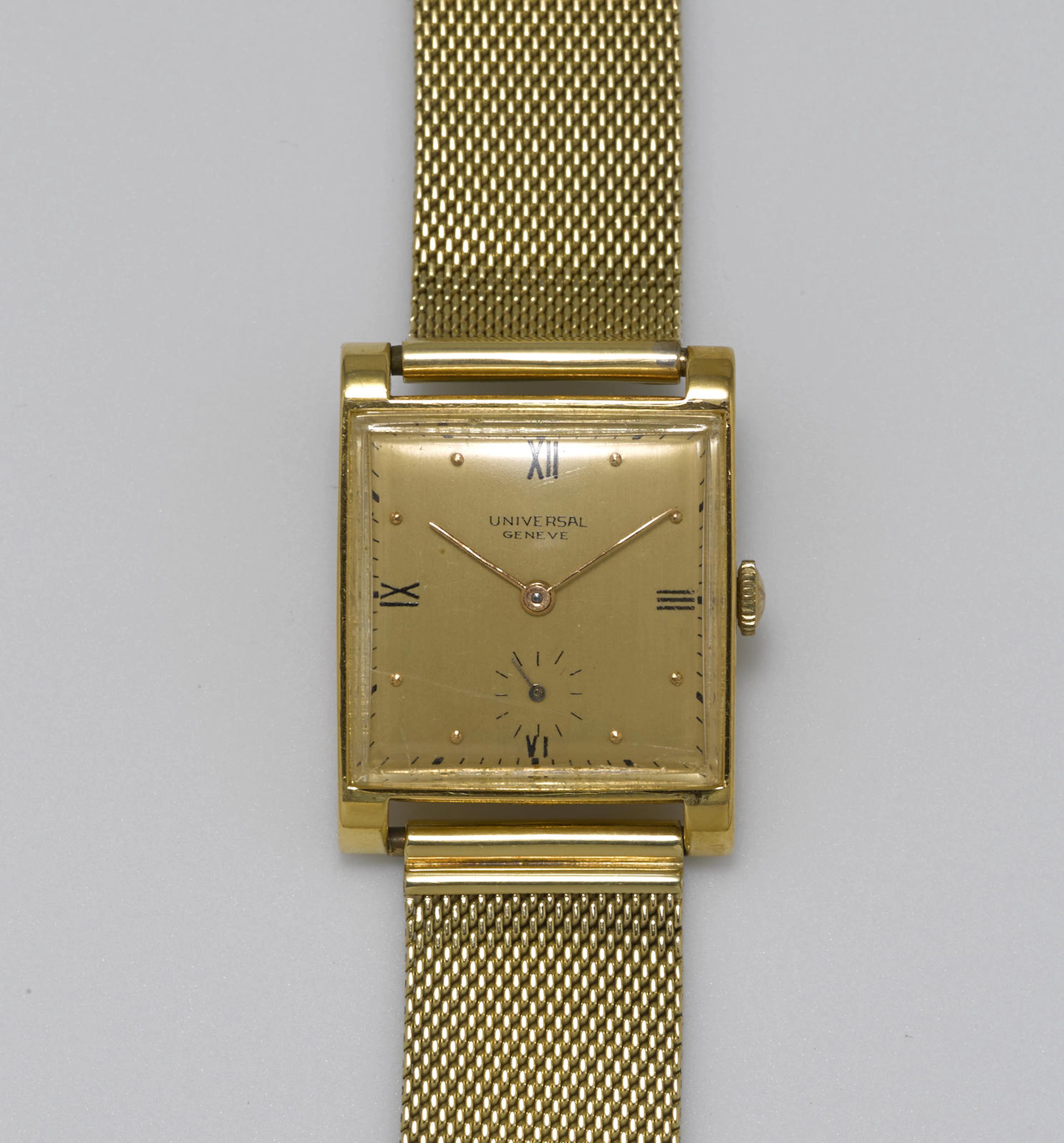 An 18k gold wristwatch, Universal Geneve, with later 14k gold bracelet