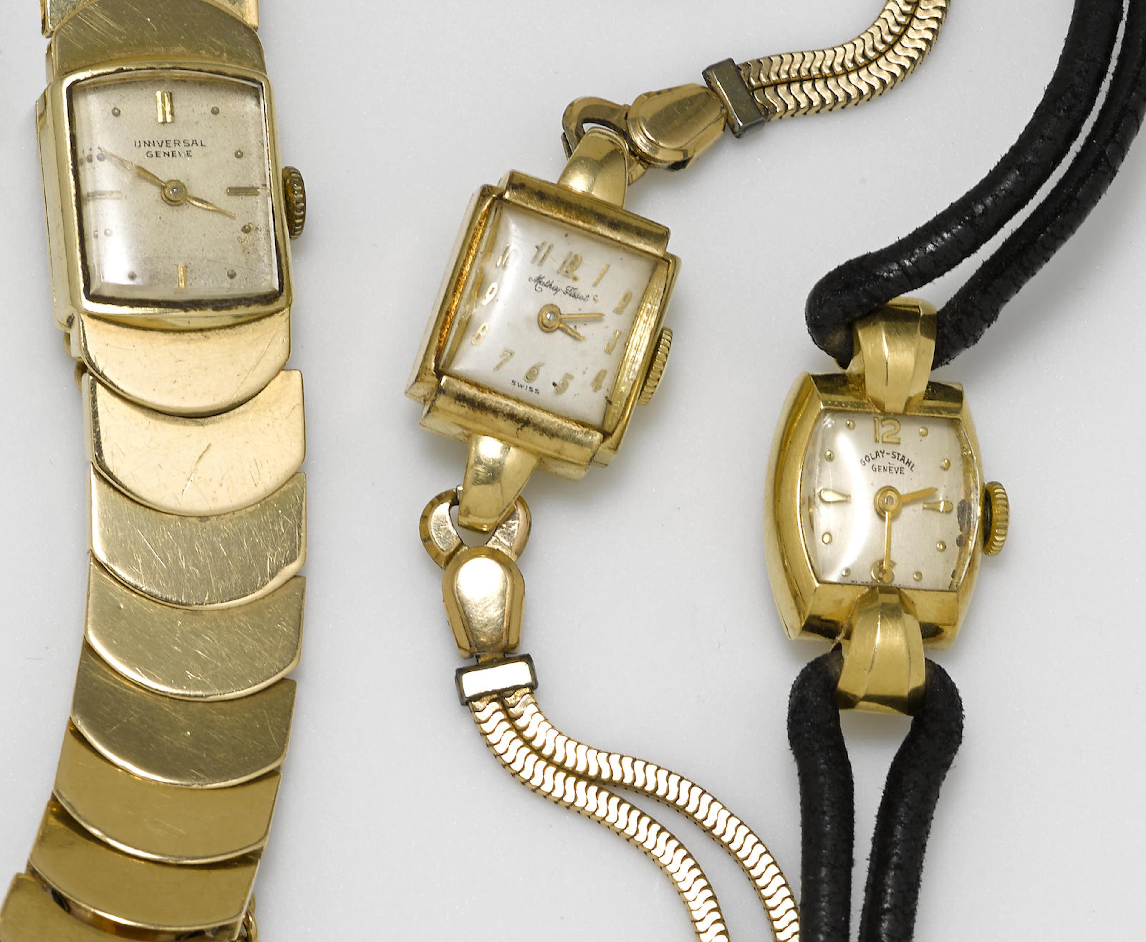 Three 14k and 18k gold wristwatches, Golan-Stahl, Mathey-Tissot, and Universal Geneve, two with later leather and metal straps