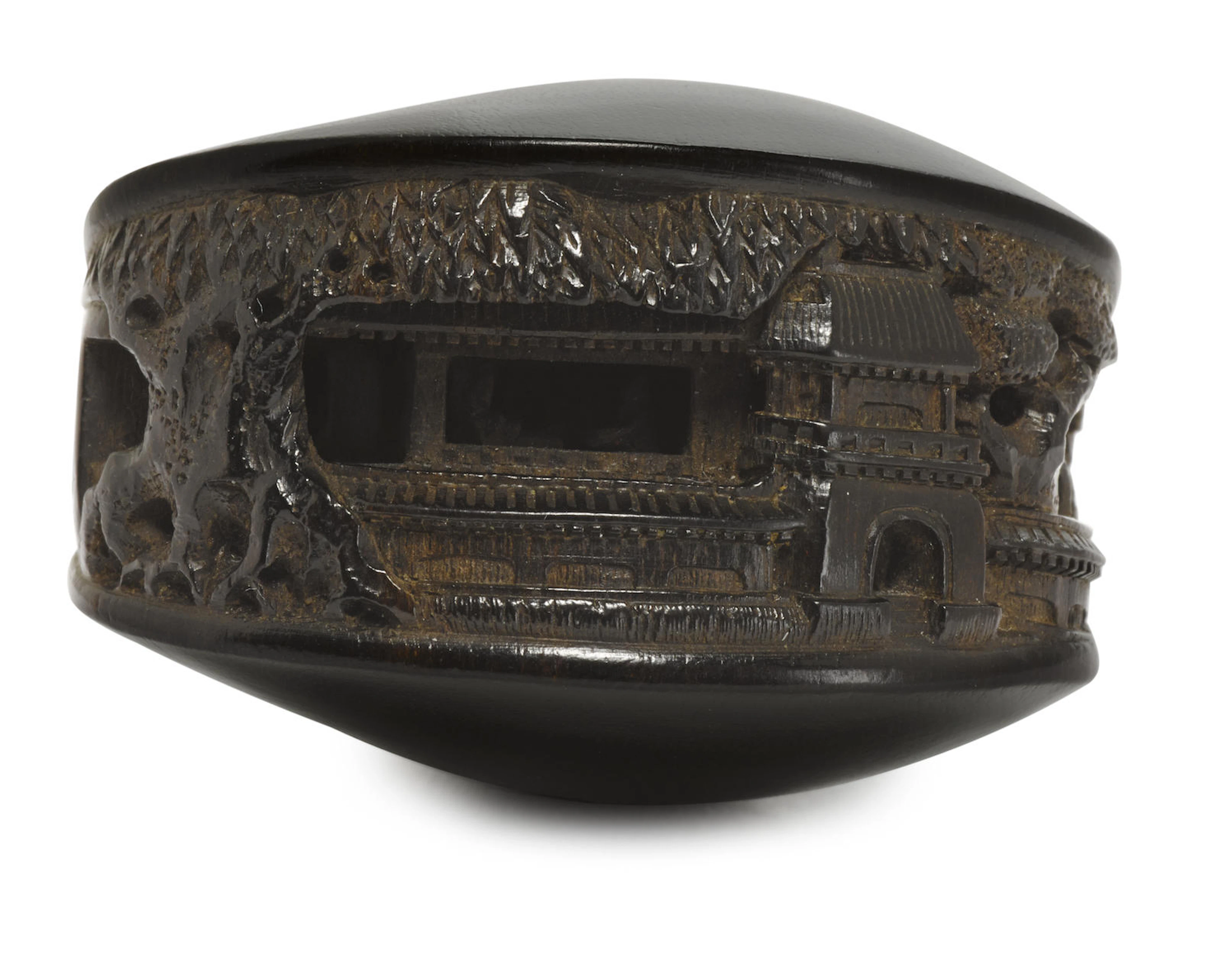 A dark wood netsuke of the clam's dream