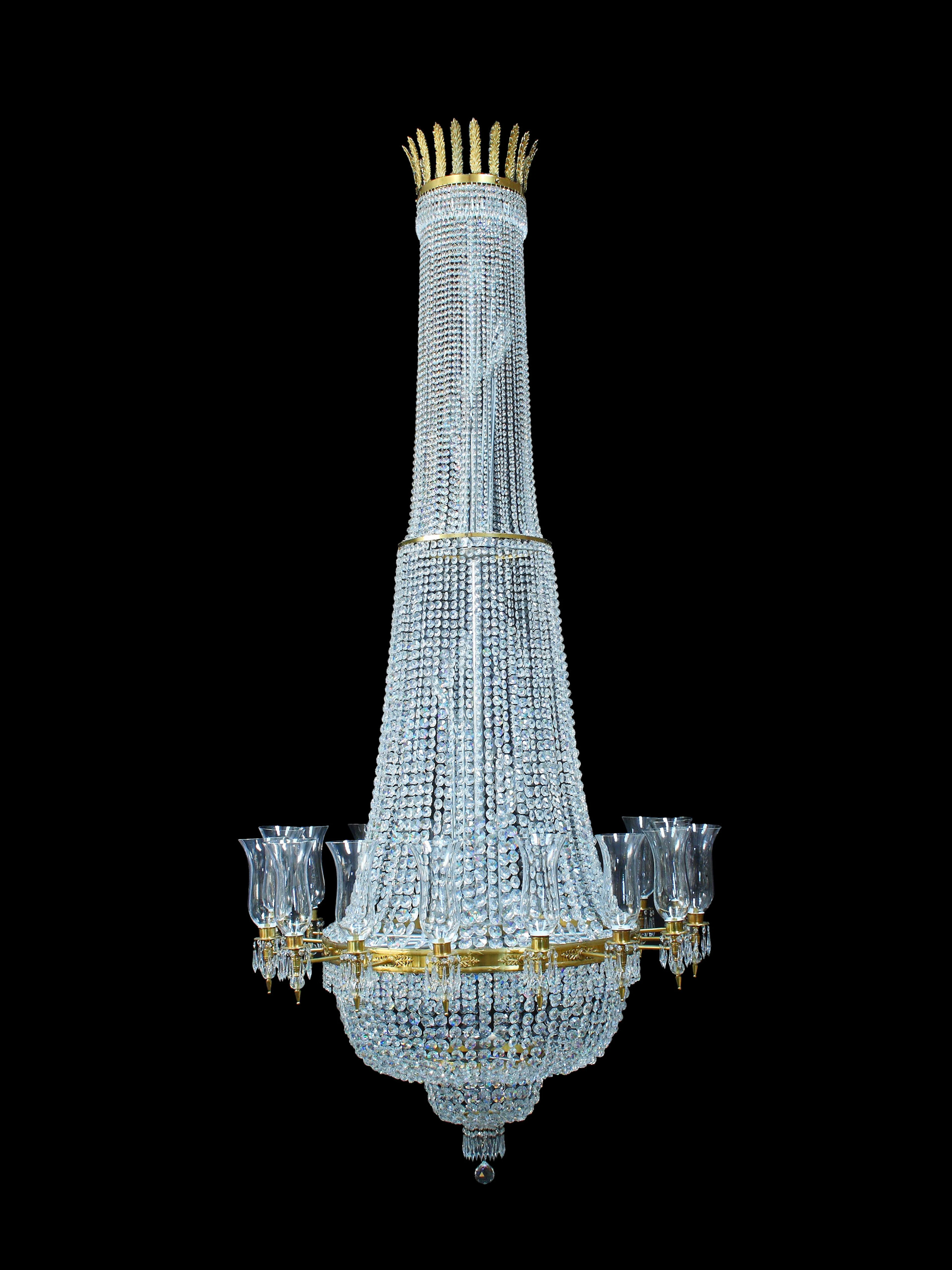 An impressive gilt brass and Swarovski-Strass cut glass strung and hung sixteen light tent and bag chandelier in the Empire style, manufactured for Asprey and Company and with theatrical provenance