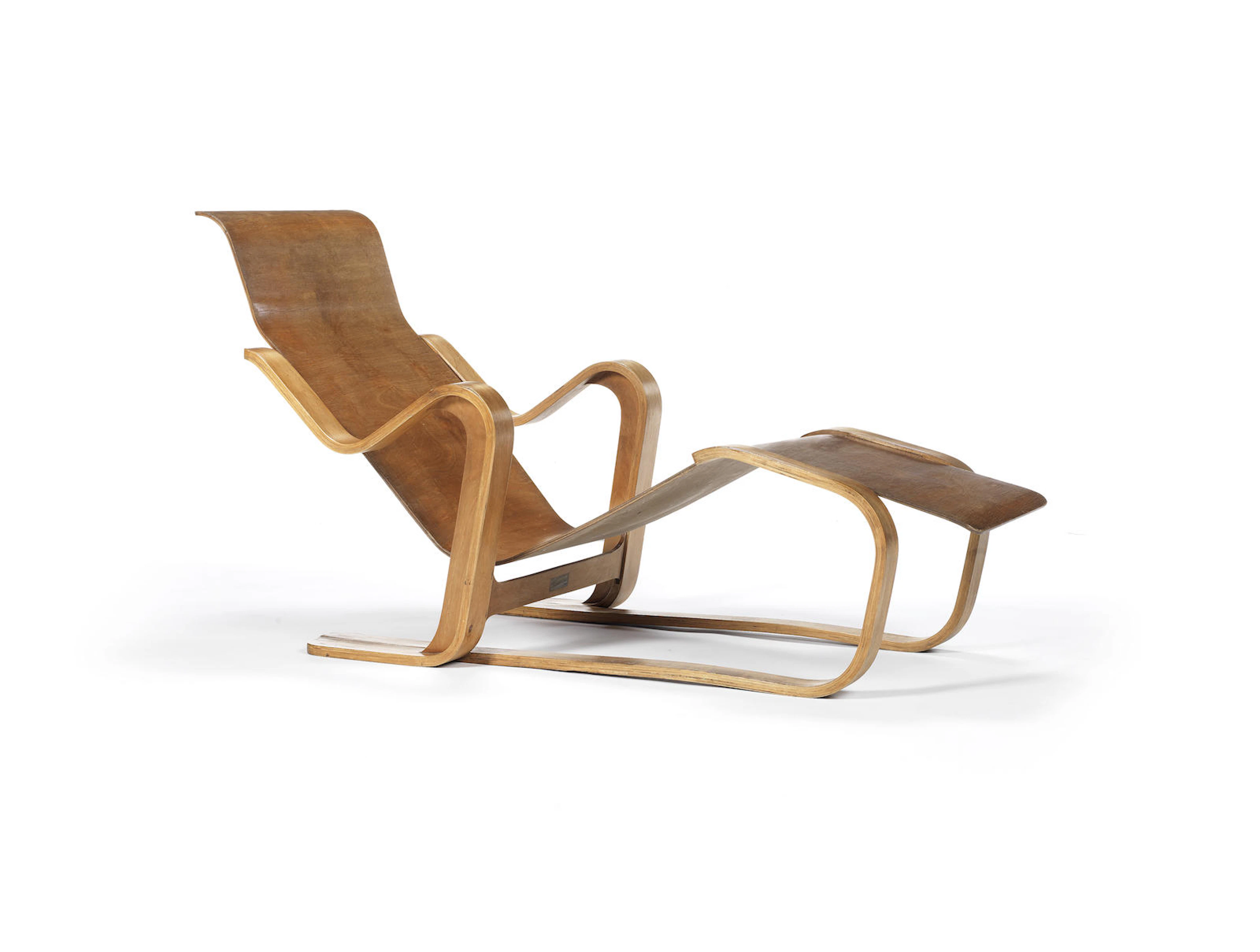 Marcel Breuer for Isokon Furniture Company A Long Chair circa 1936paper label for Isokon Furniture Co., London, Isokon Long Chair birch faced moulded plywood Height: 75 cm. 29 1/2 in. Length: 140 cm. 