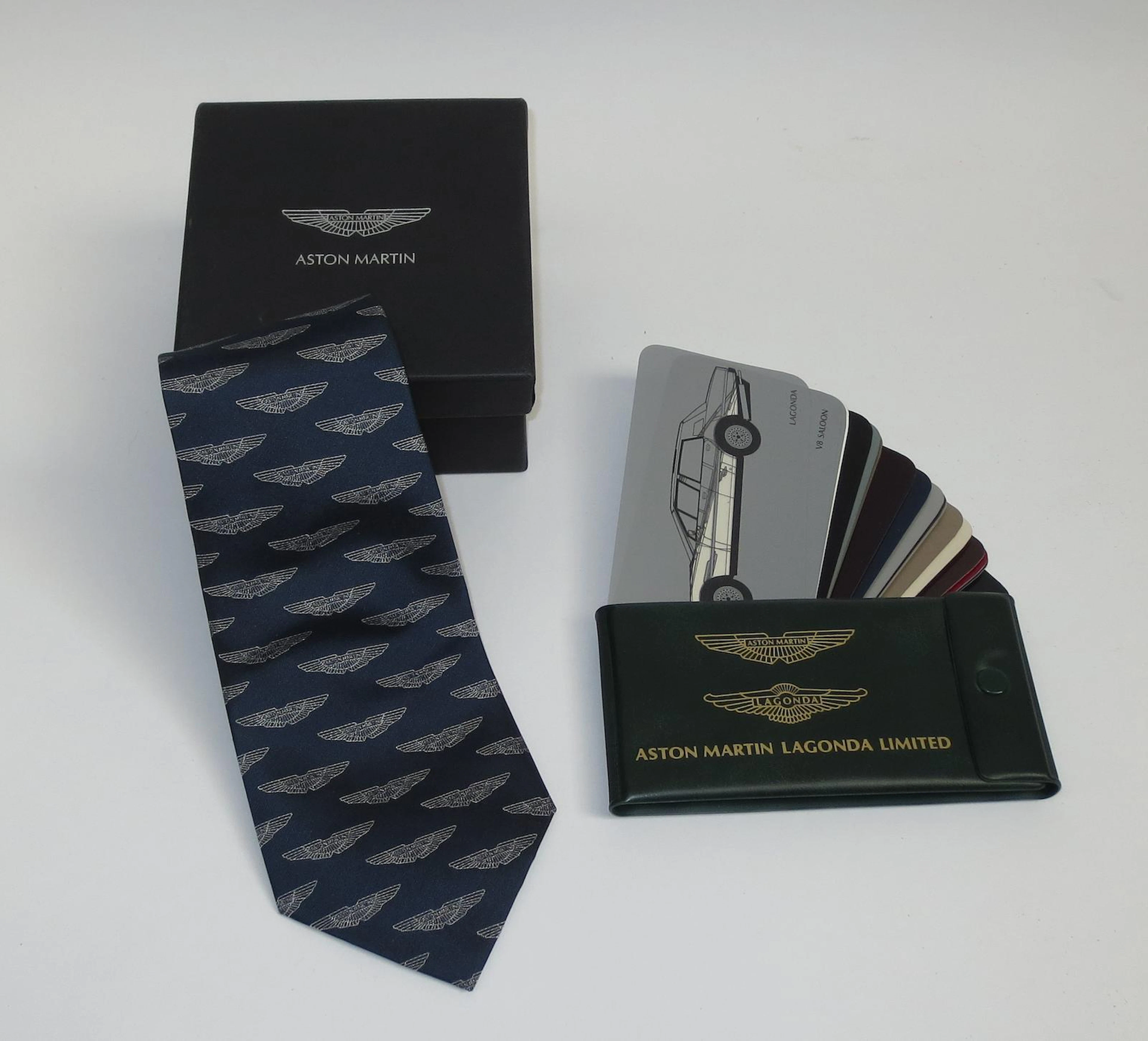 An Aston Martin silk tie and a paint colour samples booklet,