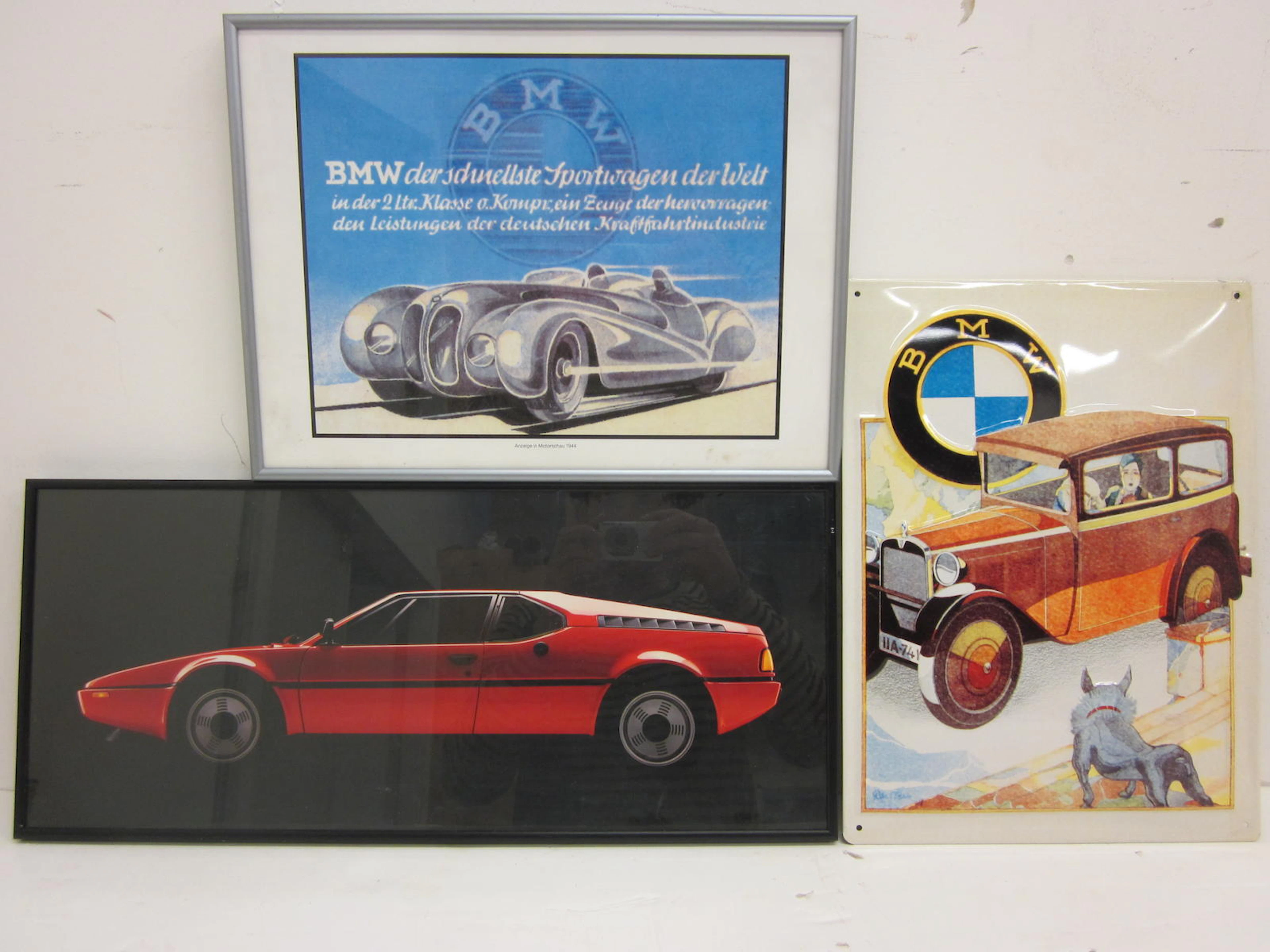 A grouping of framed BMW motosport prints,