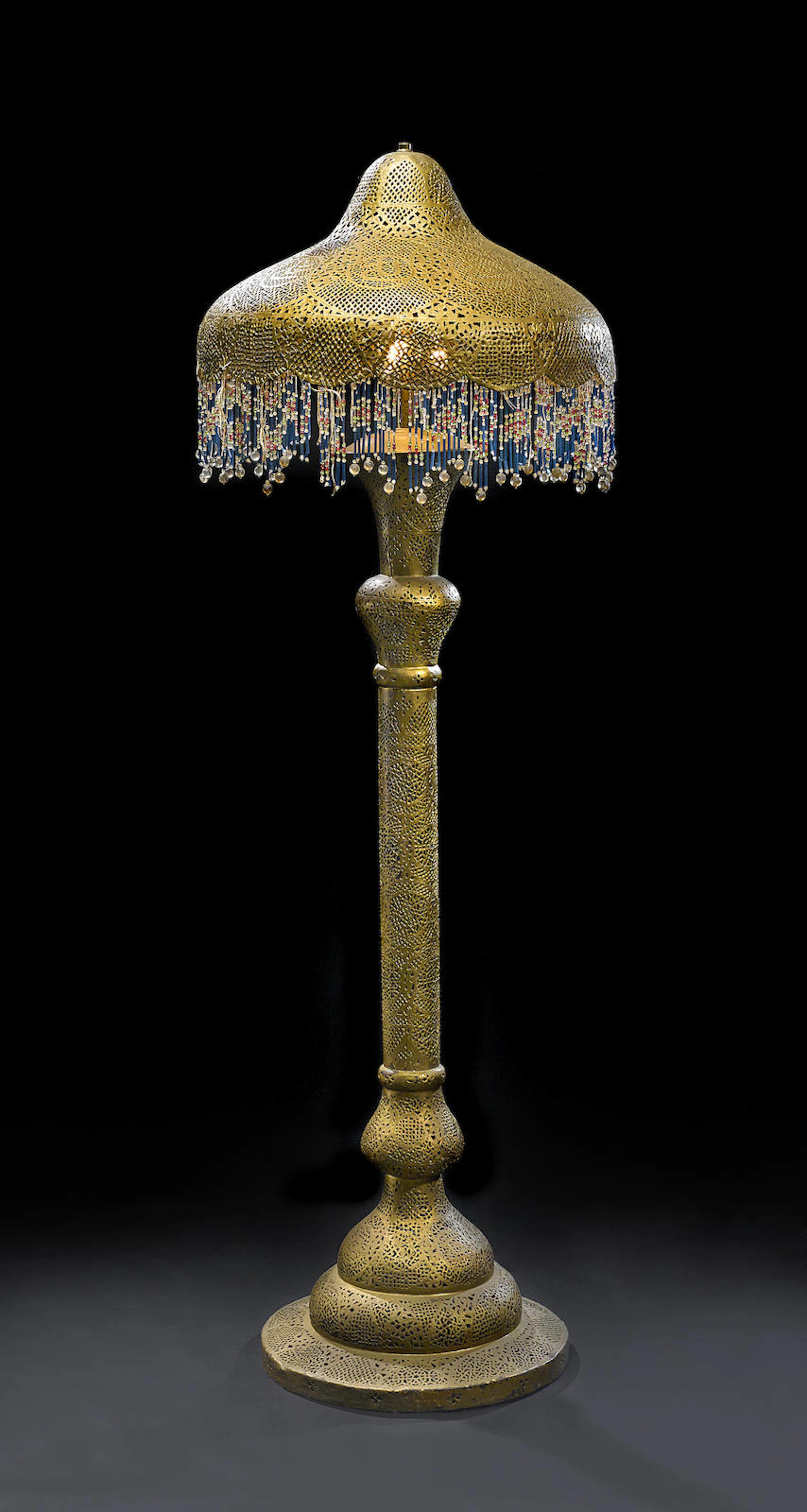 A Moroccan-style gilt and painted metal floor lamp from Casablanca