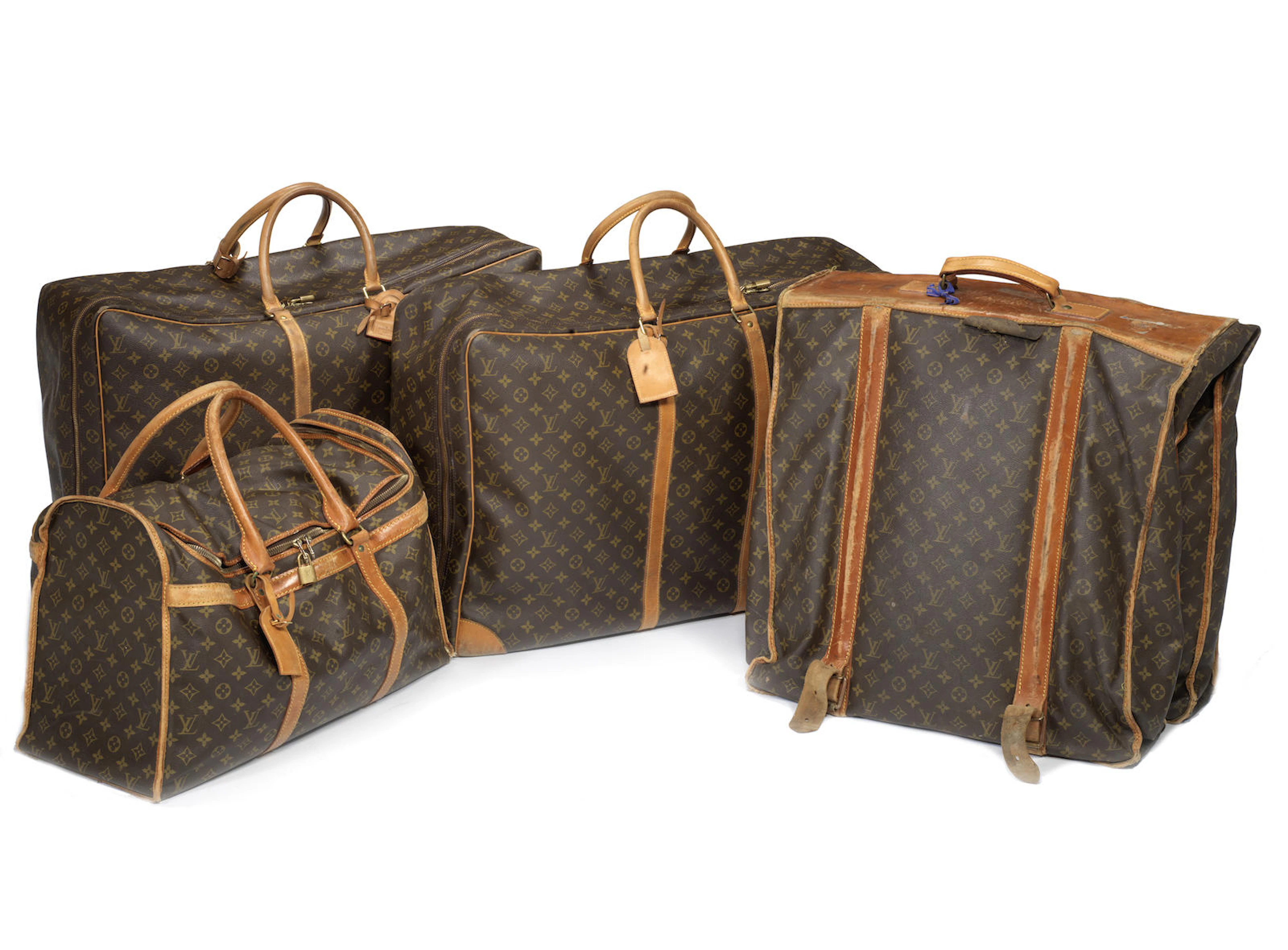 Four items of Louis Vuitton luggage,