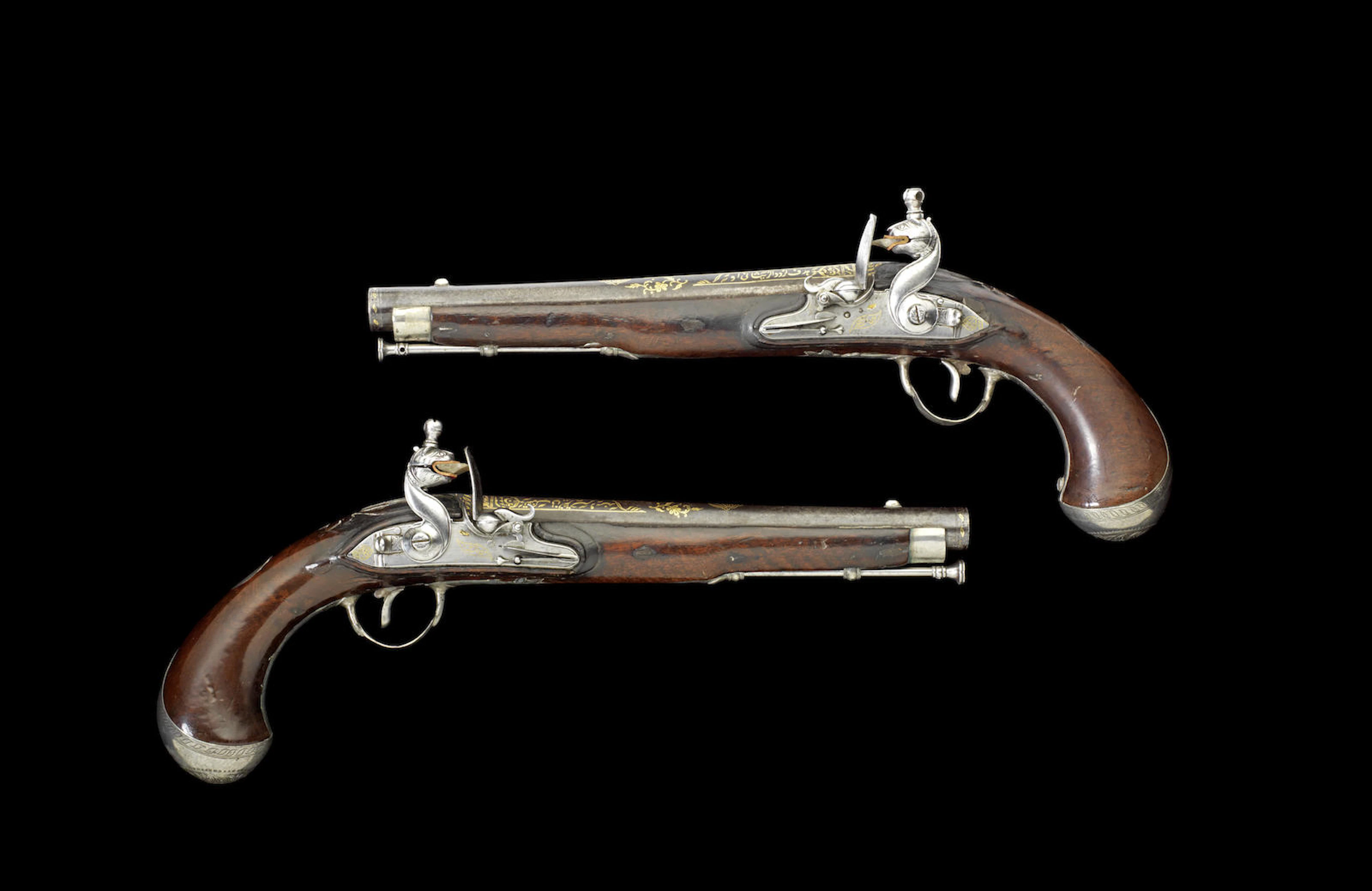 A pair of silver-mounted Flintlock Pistols with left and right-hand locks, made for Tipu Sultan by Asad-e Amin, the royal workshop Seringapatam, dated Mawludi 1223/ AD 1794-95 (2)