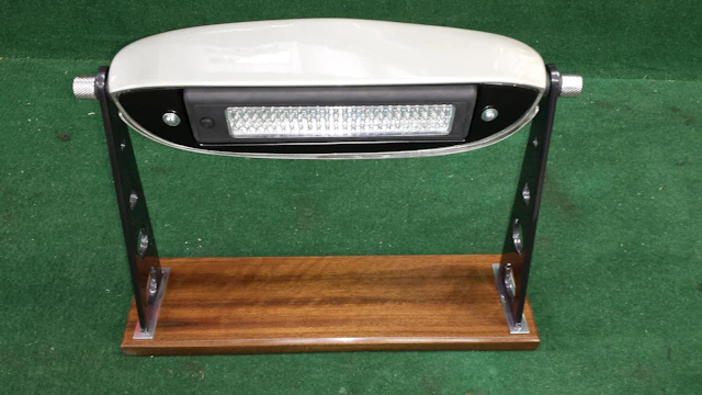 A Unique Aston Martin DB5 desk lamp custom made by Staff at the Aston Martin Works Service in 2015, and offered on behalf of the Willen Hospice (Registered Charity Number 270194),