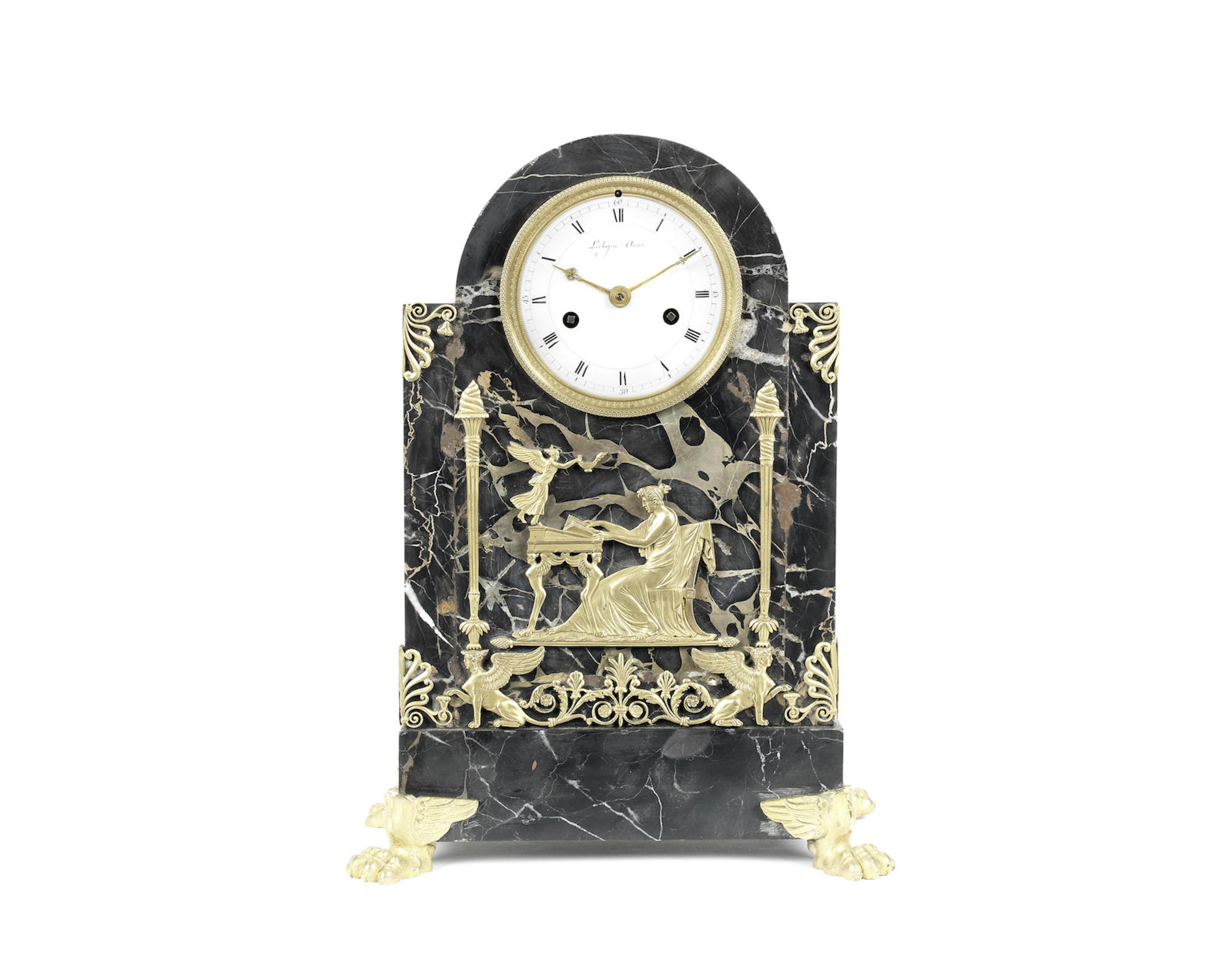 An early 19th century French gilt bronze mounted Porto marble mantel clock