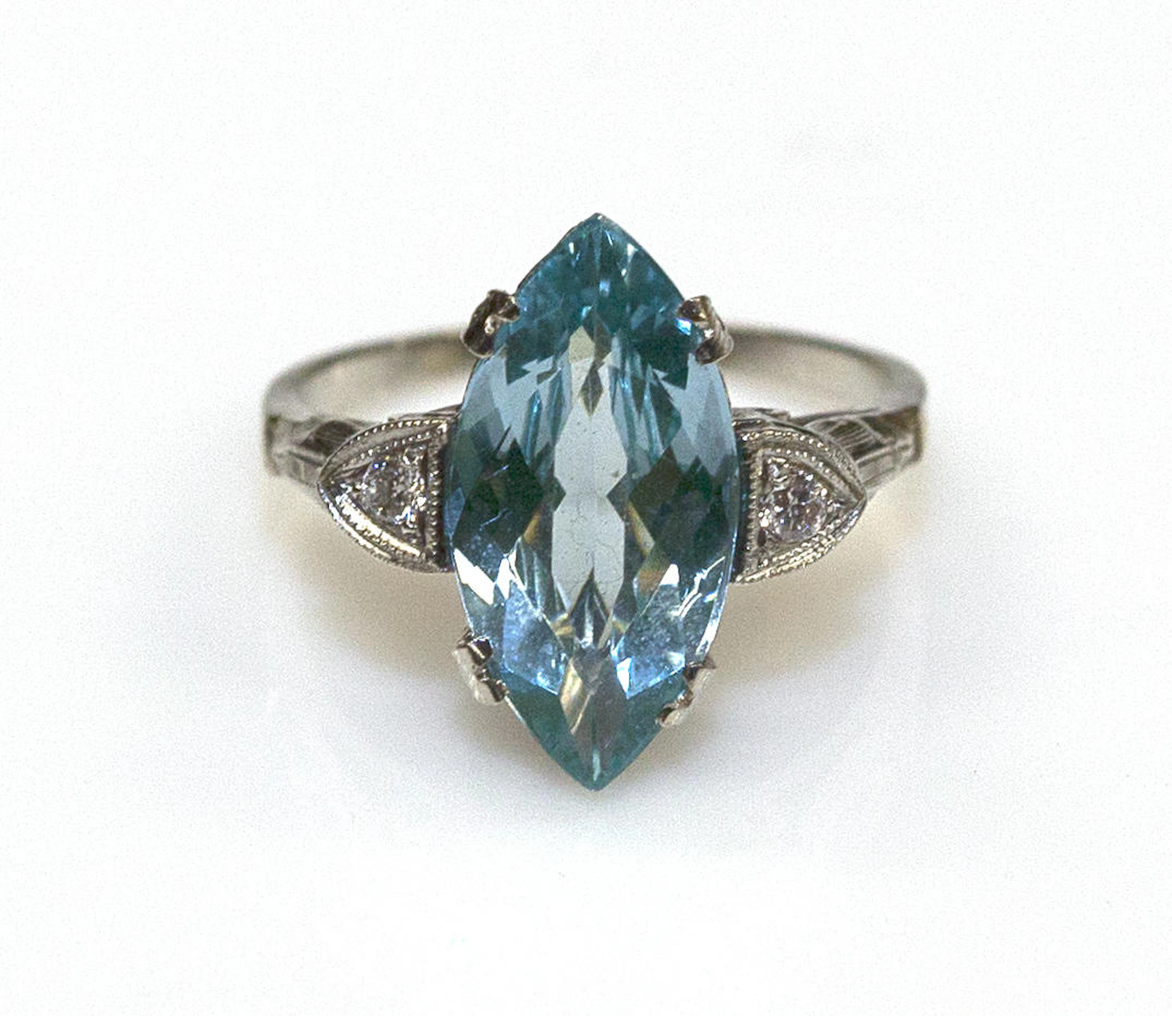 A synthetic blue spinel, diamond and 14k white gold ring