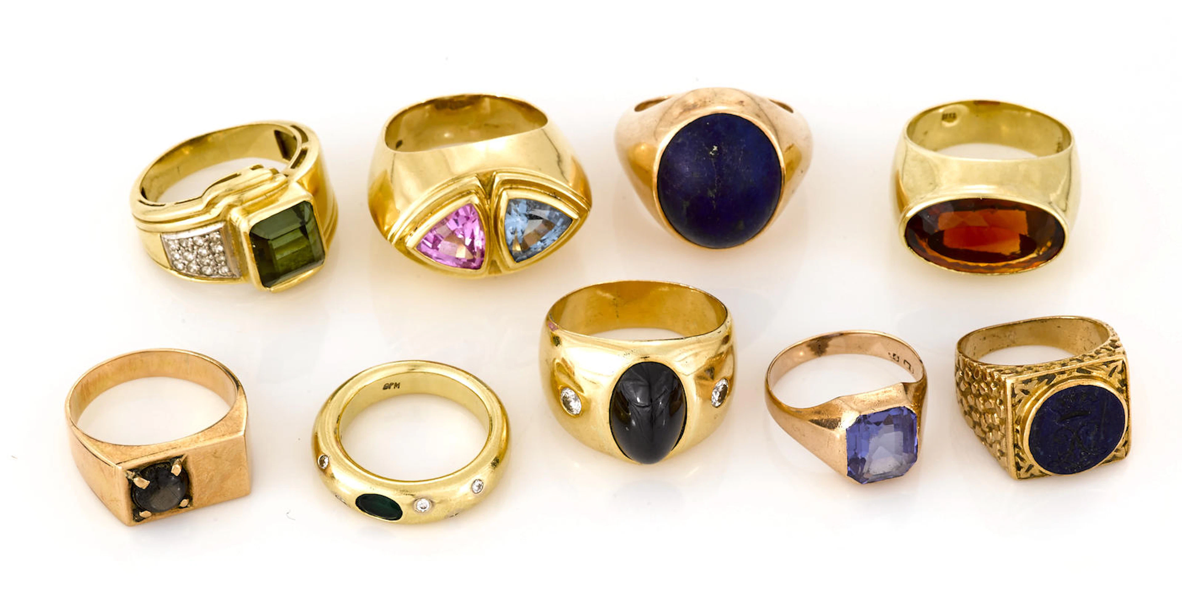A collection of nine gem-set, diamond and various karat gold rings