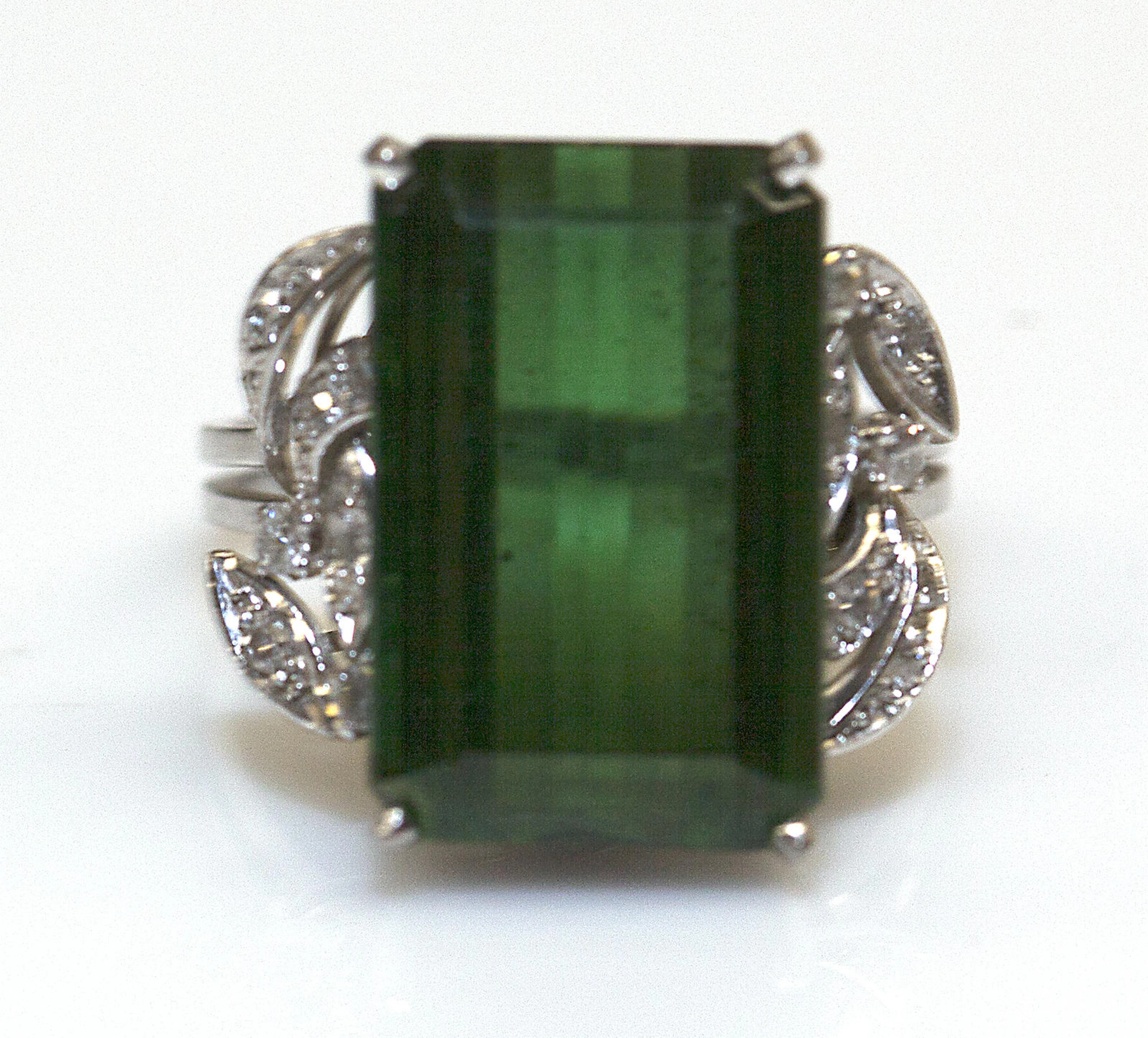 A green tourmaline, diamond and 14k white gold ring