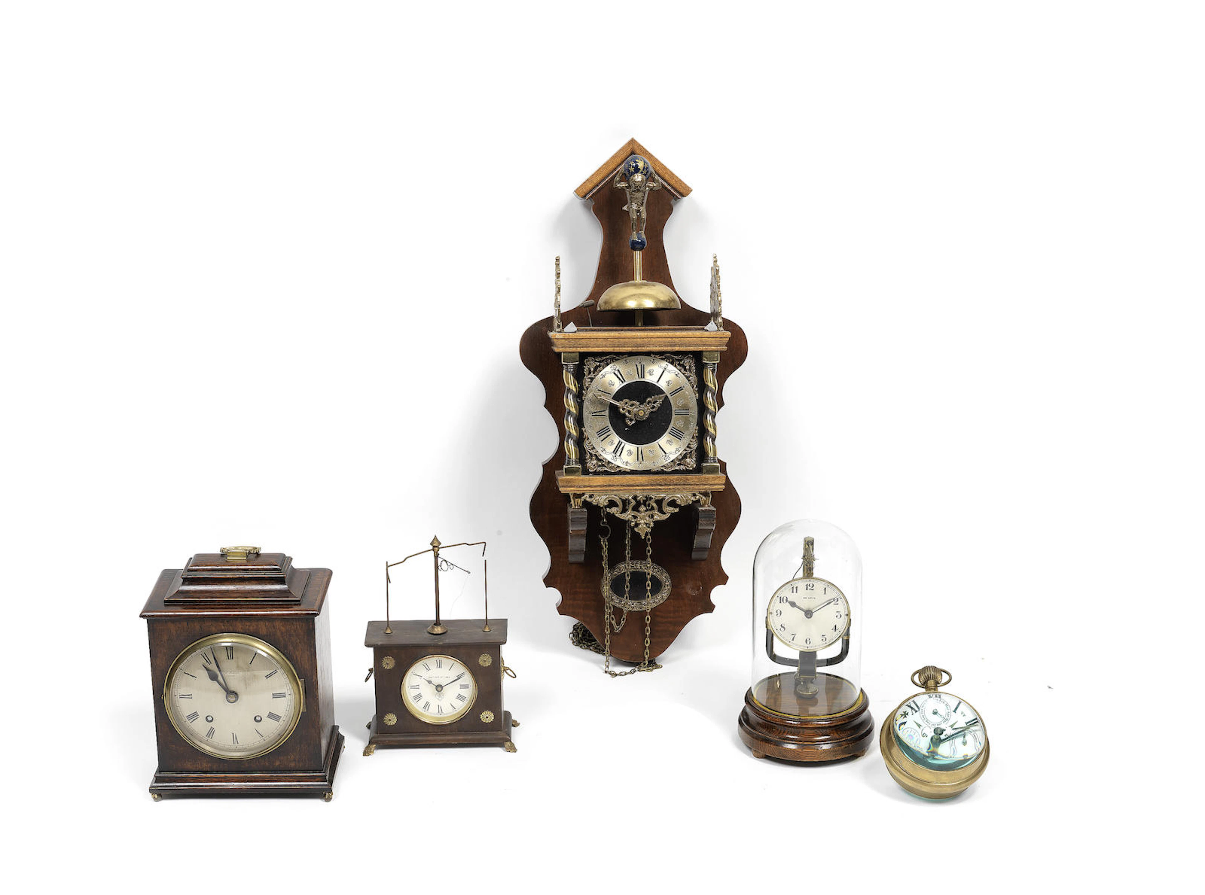 An early 20th electric mantel timepiece together with a similar period rotary pendulum patent timepiece, a similar period oak mantel clock, a modern ball desk calender timpiece