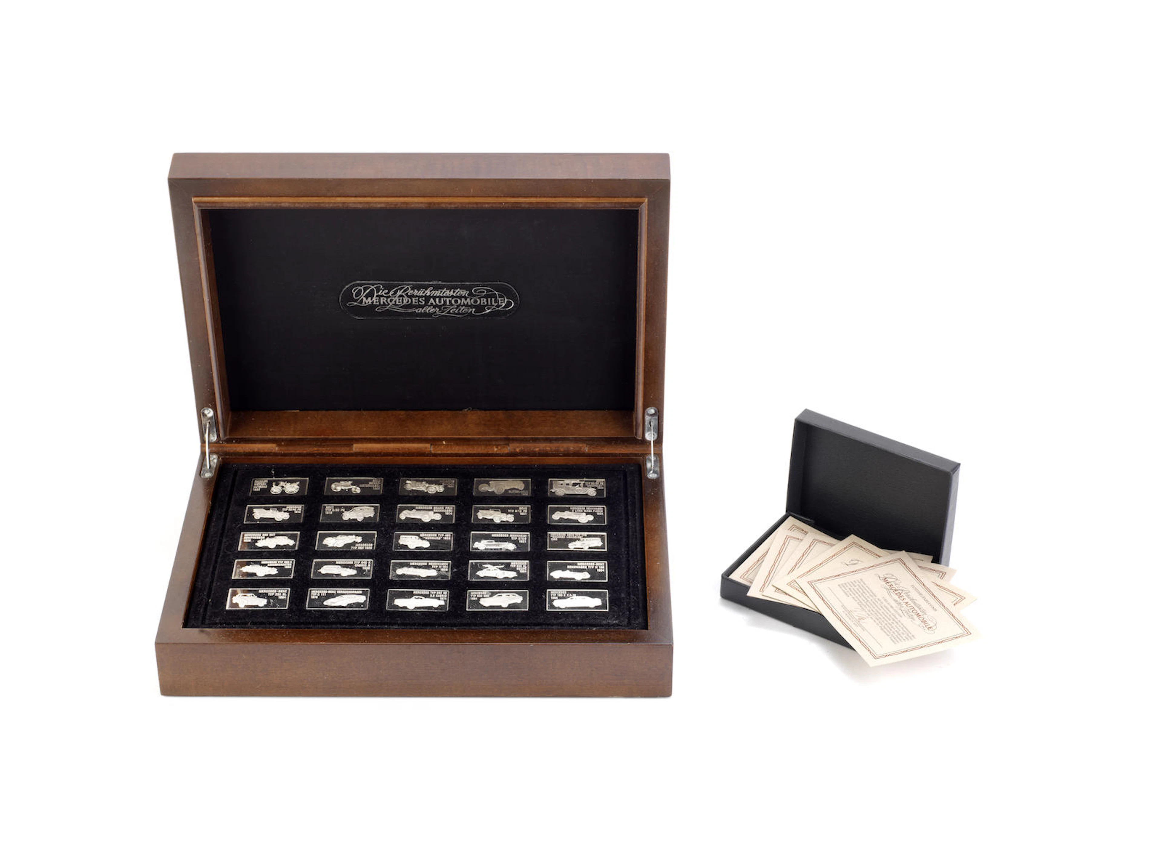 A cased set of Mercedes-Benz sterling silver commemorative ingots, by Reinhold Humbold for Franklin MInt, 1985,