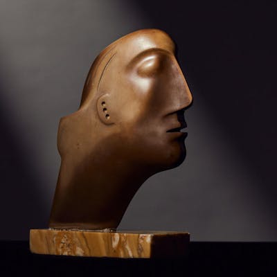 Henry Moore O.M., C.H. (British, 1898-1986) Head 17.7 cm. (7 in.)