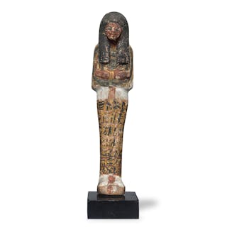 An Egyptian polychrome painted wood shabti for the Deputy of the Lord