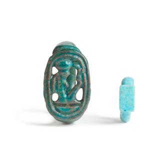 An Egyptian glazed faience openwork ring with the cartouche of Amenhotep