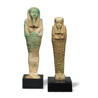 Two Egyptian glazed faience shabtis, the larger for Chief of the Army