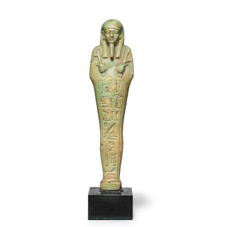 An Egyptian green glazed faience shabti for 'He who knows what exists'