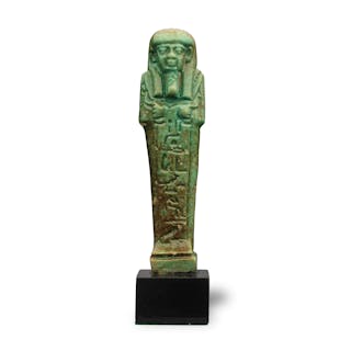 An Egyptian green glazed faience shabti for Ta-Shert-Hor