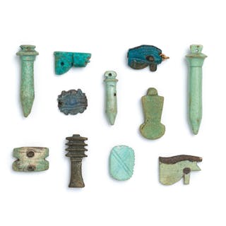 Eleven Egyptian glazed faience amulets of protective symbols 11